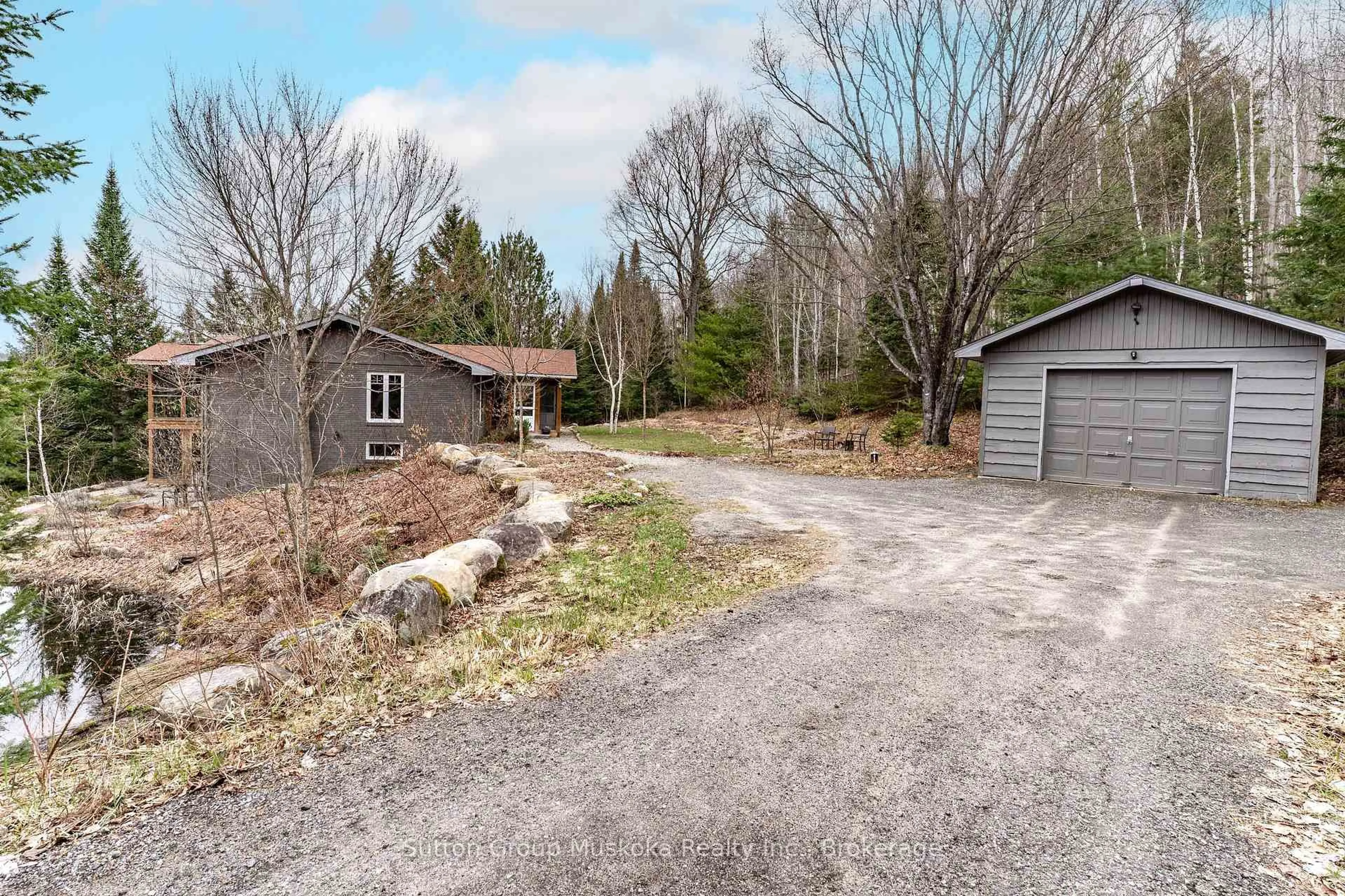 A pic from outside/outdoor area/front of a property/back of a property/a pic from drone, unknown for 209 Swallowdale Rd, Huntsville Ontario P1H 0A5