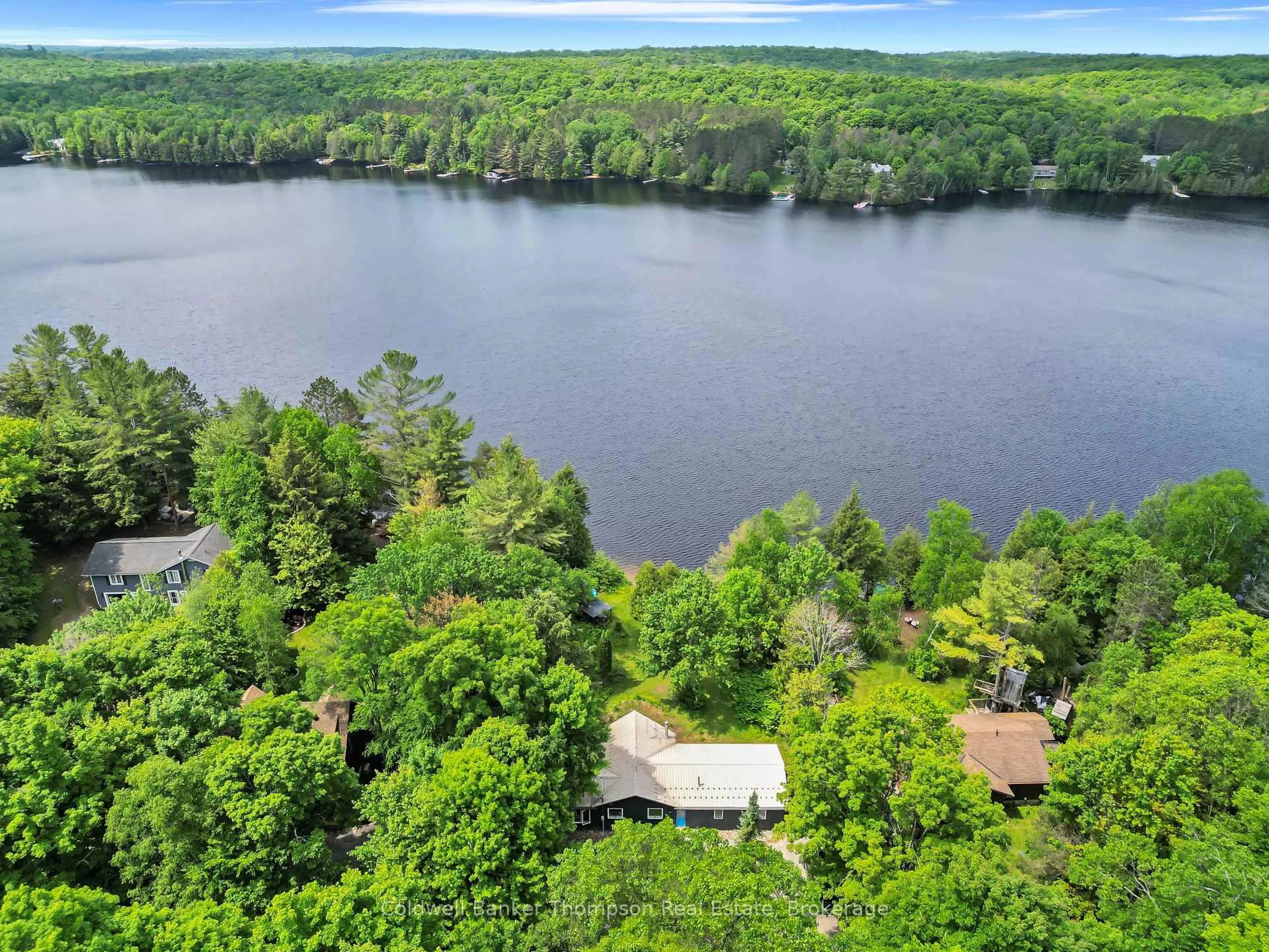 A pic from outside/outdoor area/front of a property/back of a property/a pic from drone, water/lake/river/ocean view for 810 East Waseosa Lake Rd, Huntsville Ontario P1H 2J4