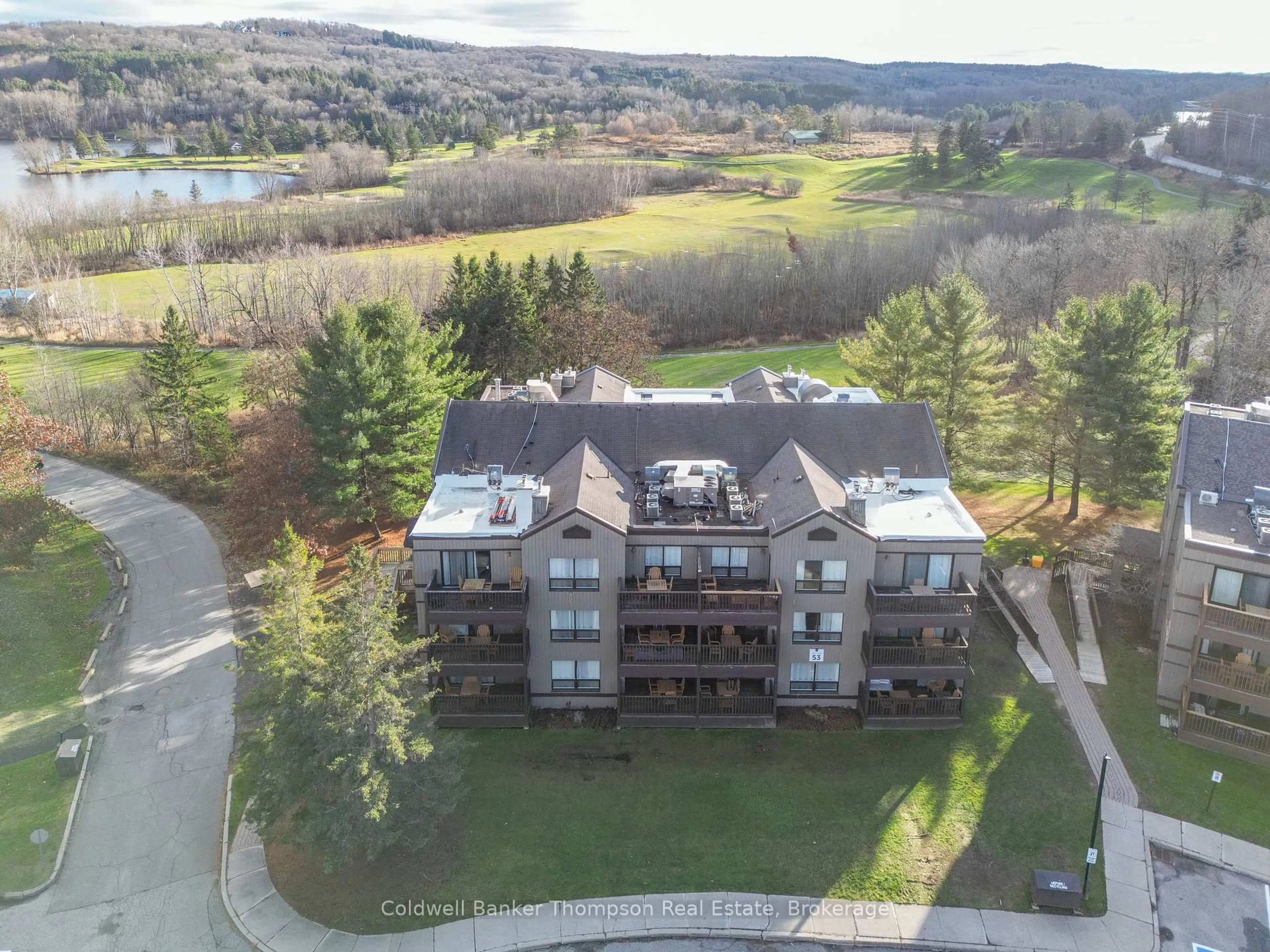 A pic from outside/outdoor area/front of a property/back of a property/a pic from drone, water/lake/river/ocean view for 1235 DEERHURST Dr #53-201, Huntsville Ontario P1H 2E8