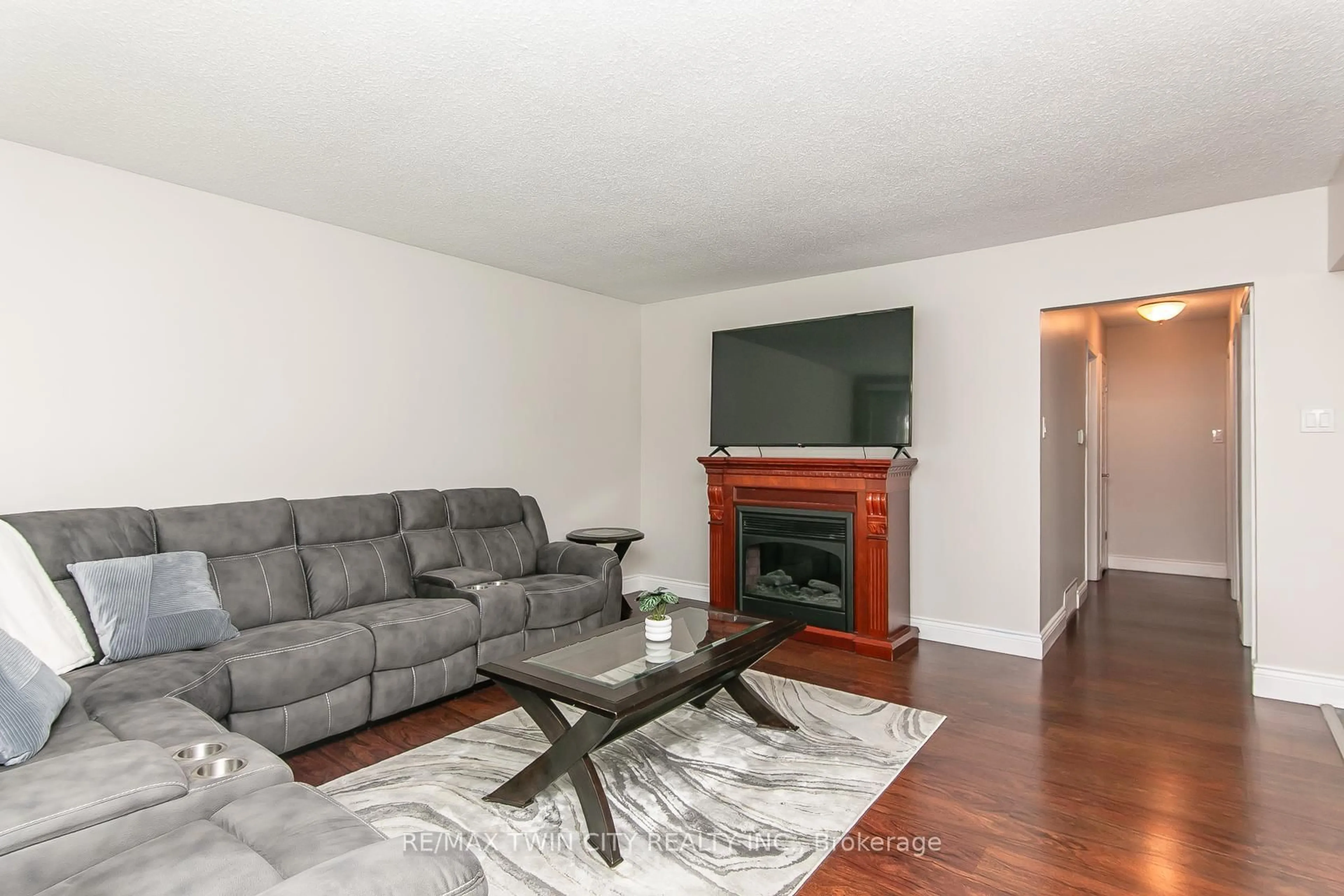 Living room with furniture, wood/laminate floor for 34 Blackhorne Cres, Kitchener Ontario N2E 1T1