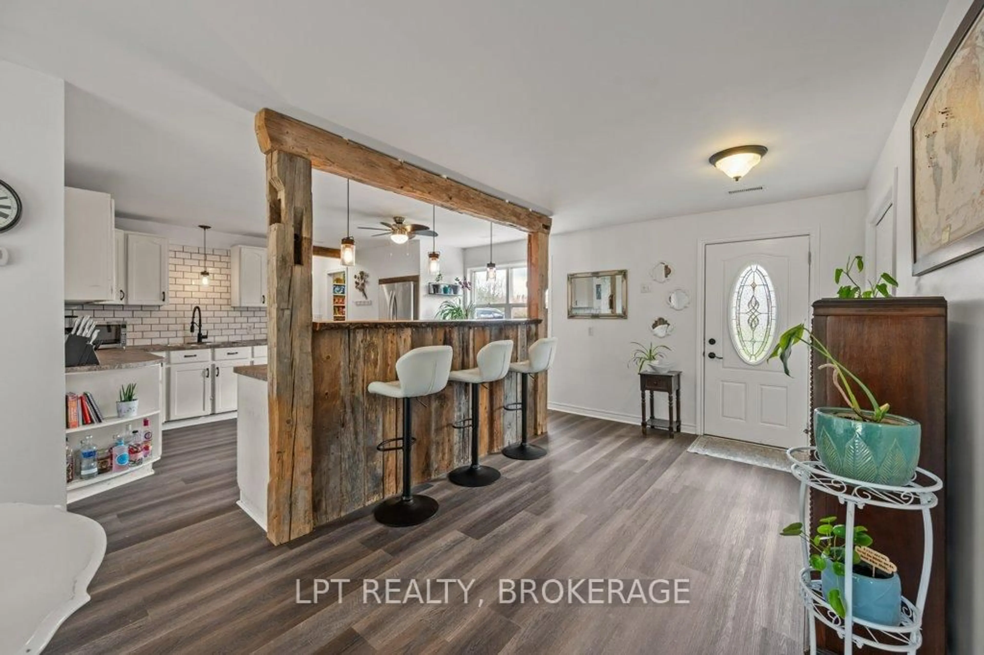 Open concept kitchen, wood/laminate floor for 10551 Hwy 38 Highway, Parham Ontario K0H 2K0
