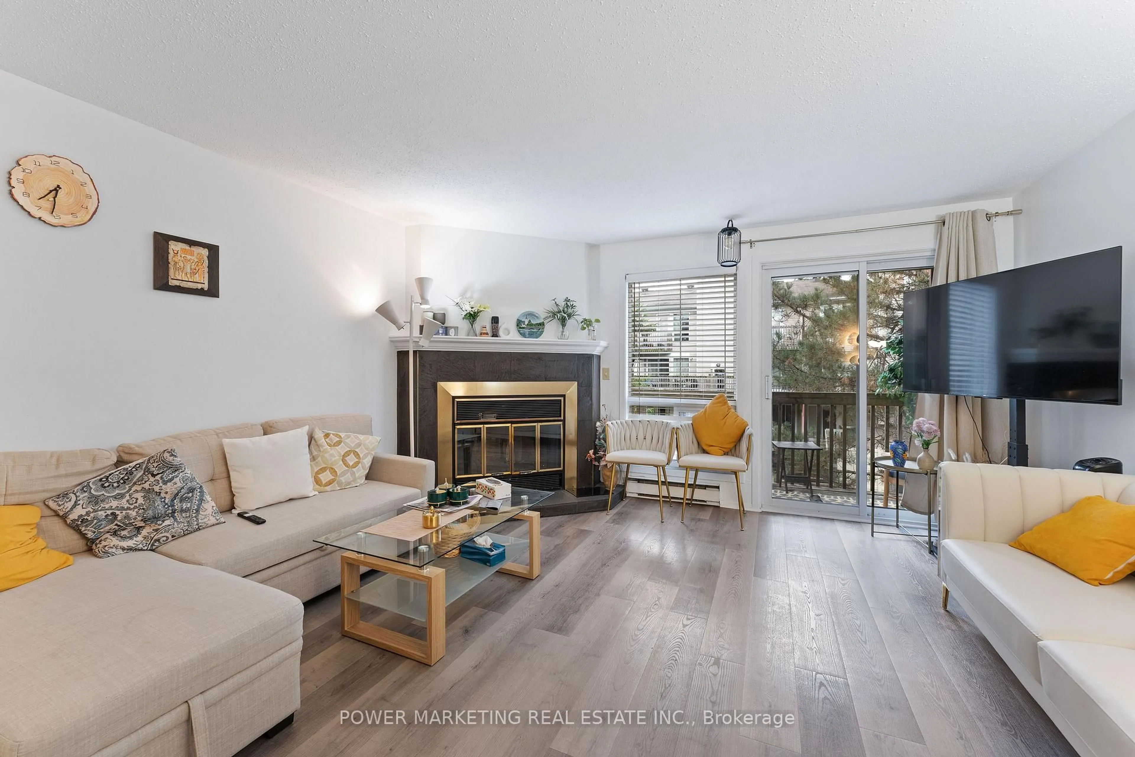 Living room with furniture, wood/laminate floor for 6702 Jeanne D'arc Blvd #B, Ottawa Ontario K1C 6E9