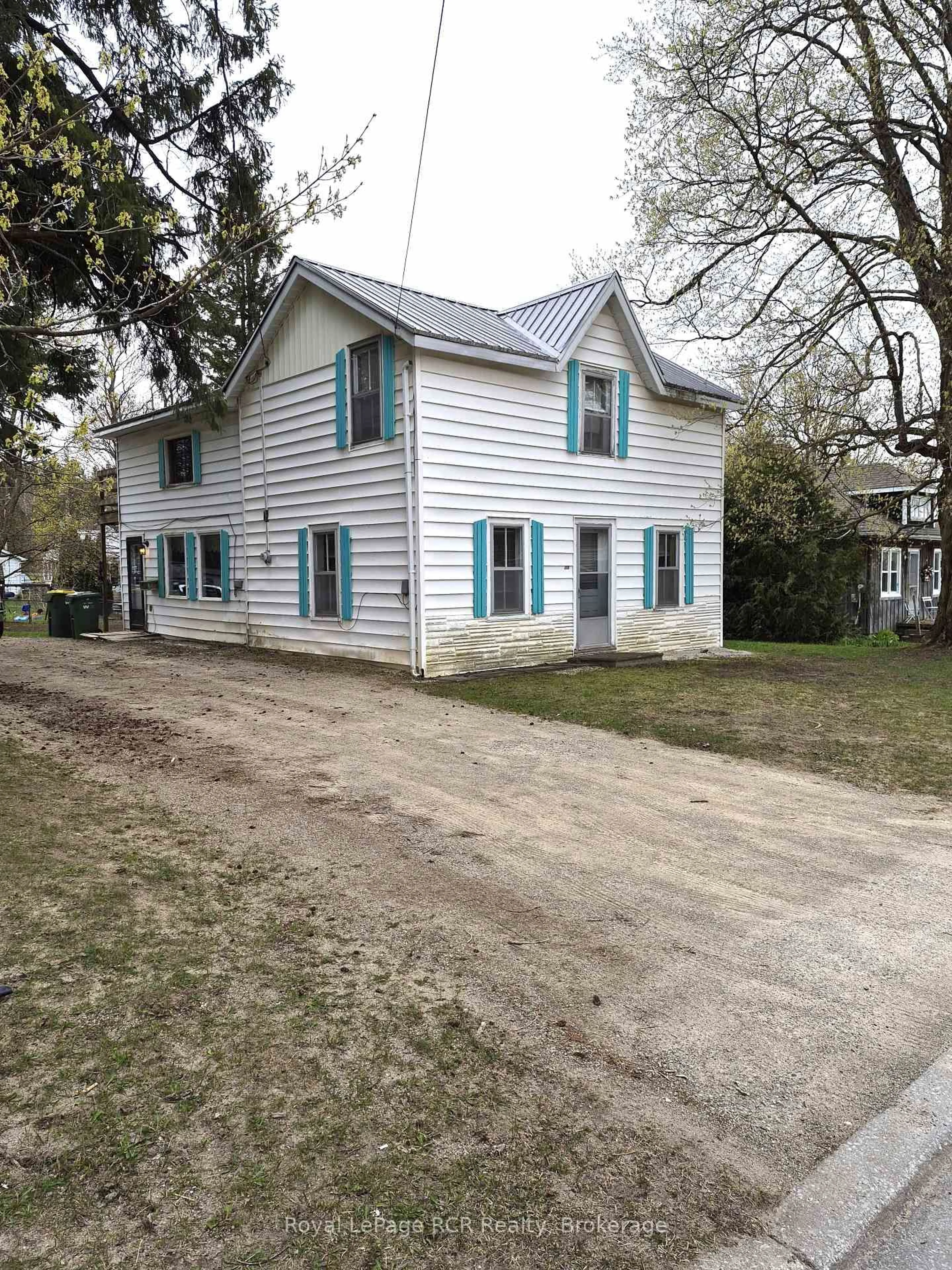 Home with vinyl exterior material, street for 115 Isla St, Grey Highlands Ontario N0C 1H0