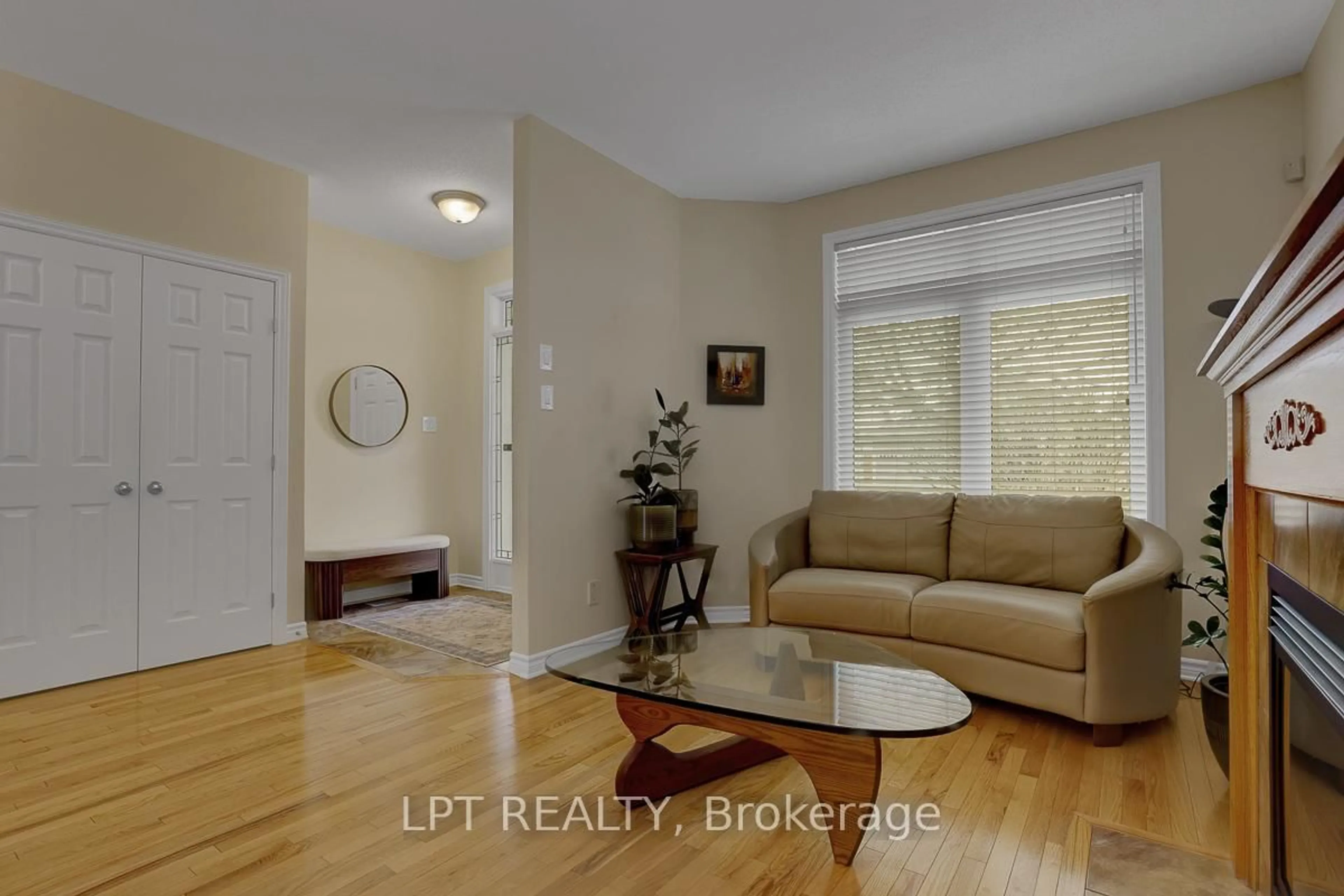 Living room with furniture, wood/laminate floor for 346 Jackson Stitt Circ, Ottawa Ontario K2S 0C4