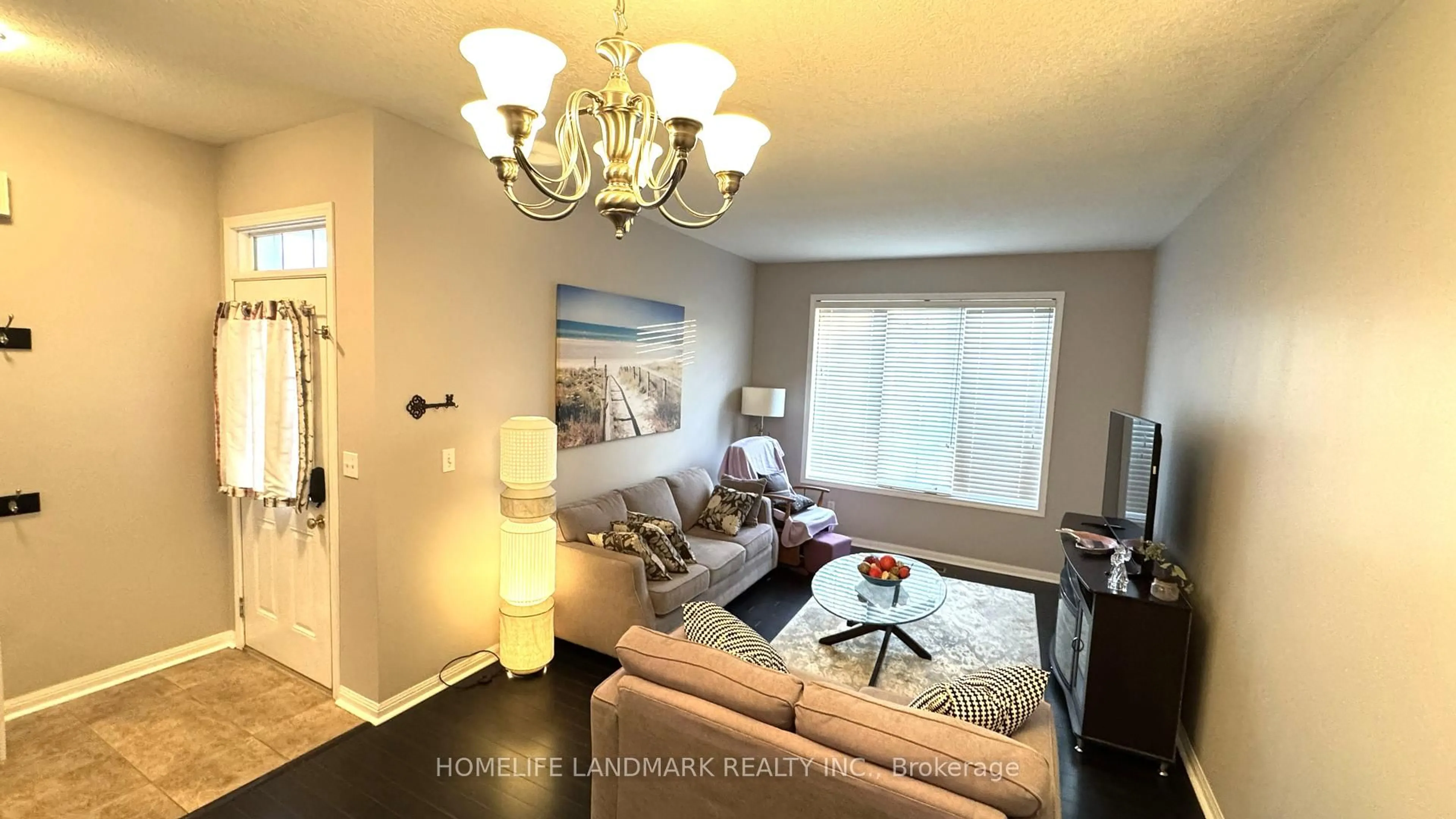 Living room with furniture, wood/laminate floor for 461 Garth Massey Dr, Cambridge Ontario N1T 2G5