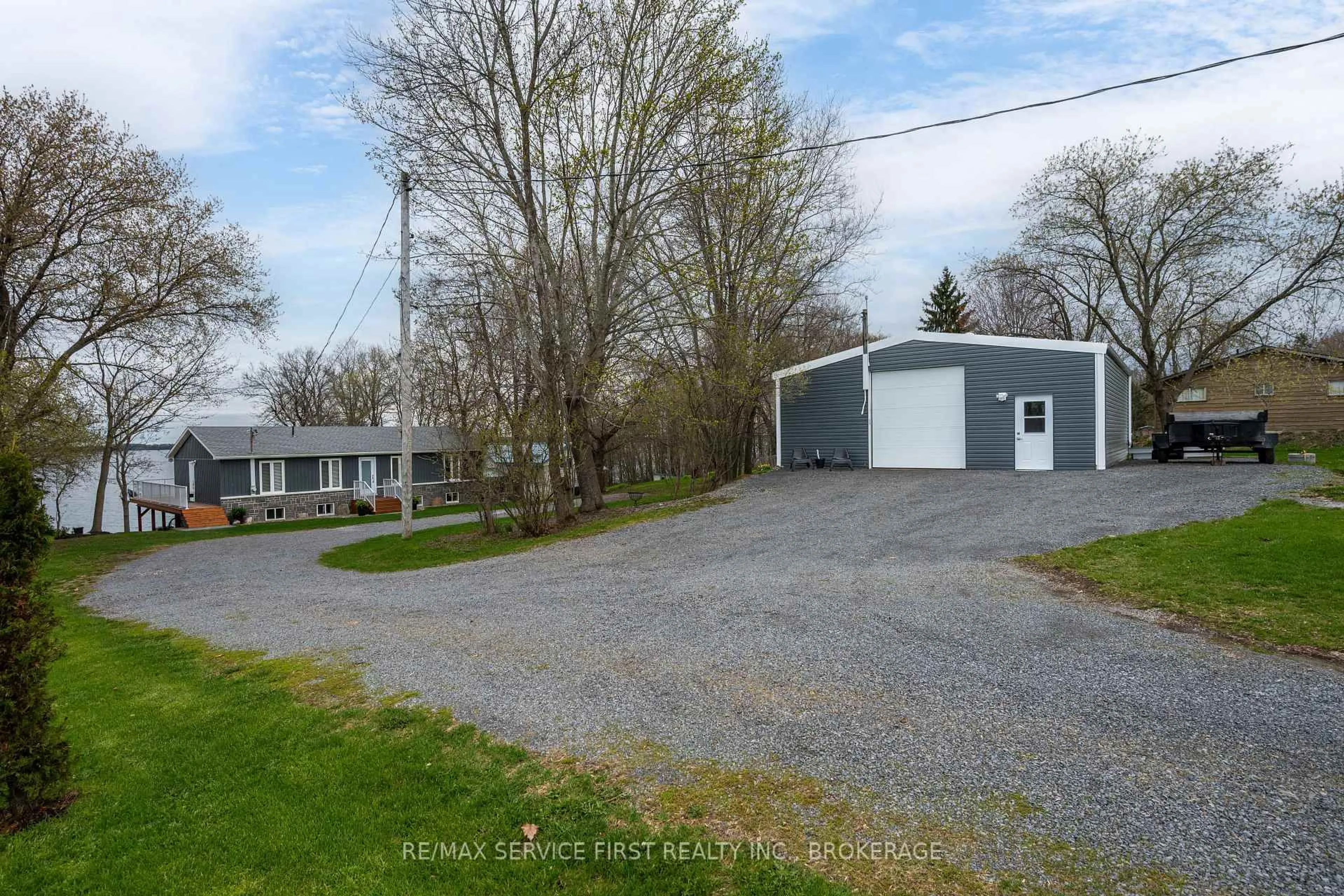 A pic from outside/outdoor area/front of a property/back of a property/a pic from drone, street for 1890 Howe Island Dr, Gananoque Ontario K7G 2V6