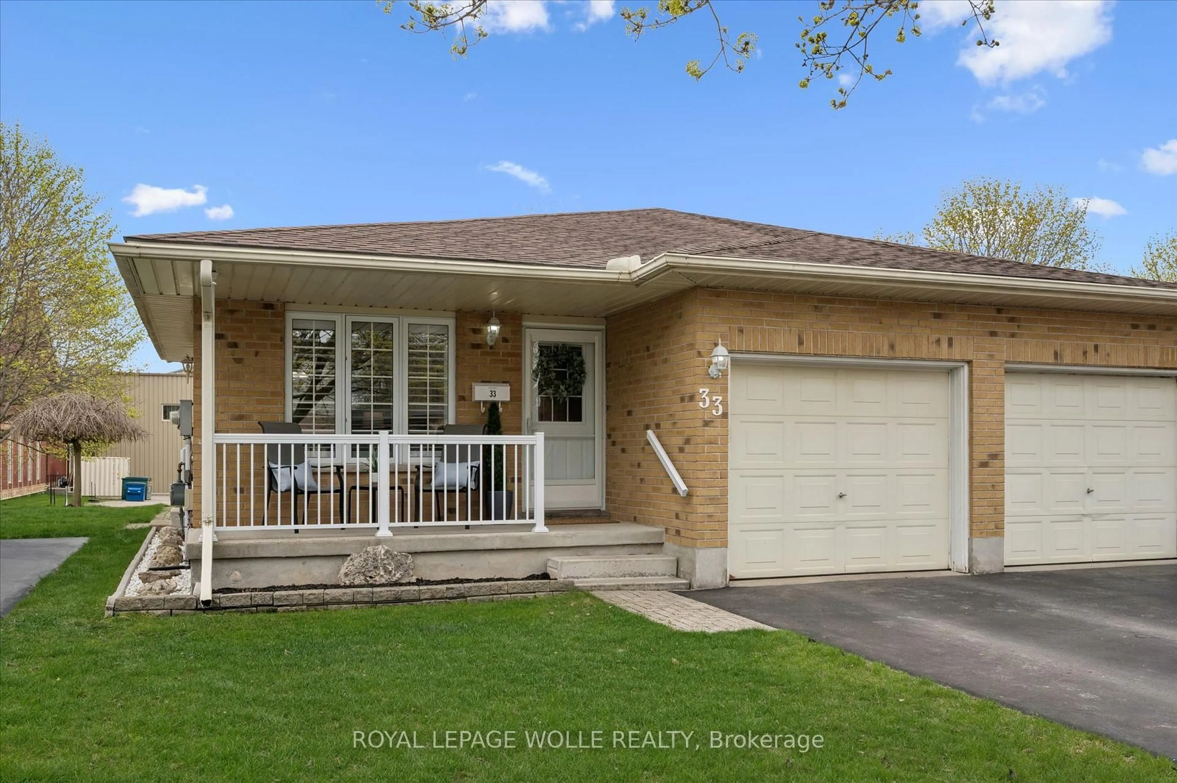 Home with brick exterior material, street for 33 Kingfisher Dr, Woolwich Ontario N3B 3K4