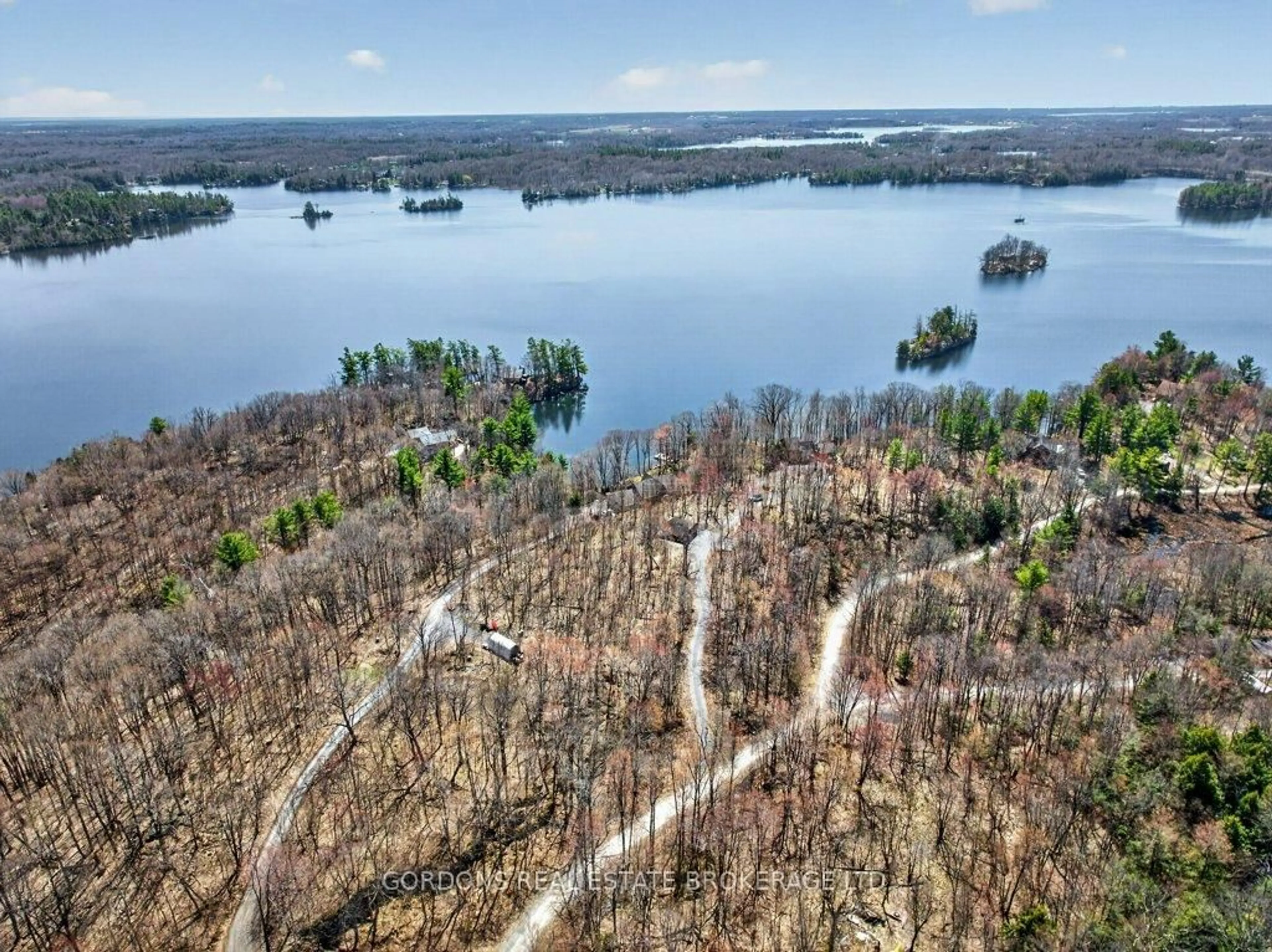 A pic from outside/outdoor area/front of a property/back of a property/a pic from drone, water/lake/river/ocean view for 4820 Huntbach Lane, Battersea Ontario K0H 1H0