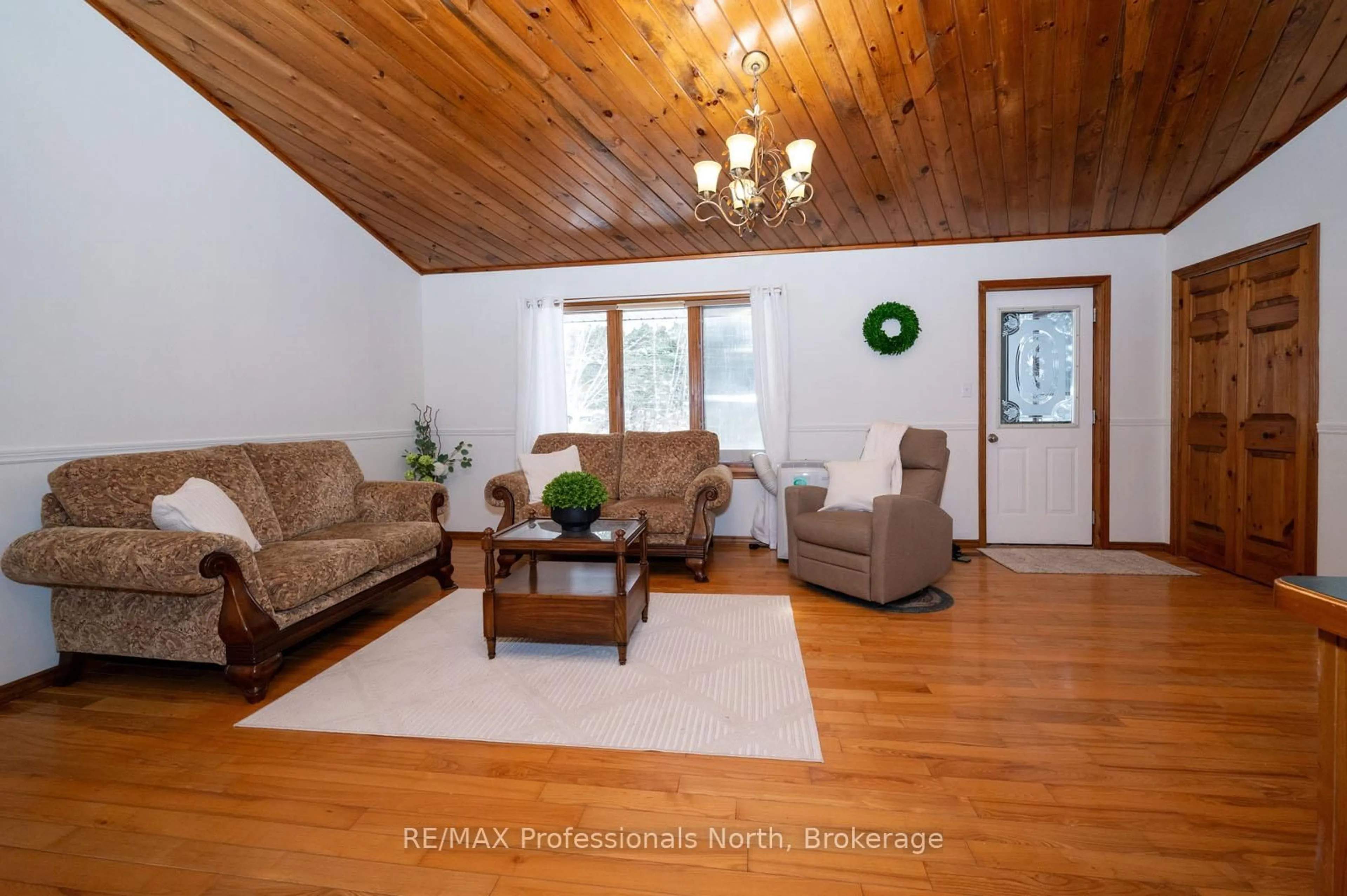 Living room with furniture, wood/laminate floor for 66 Rain Lake Rd, Kearney Ontario P0A 1M0