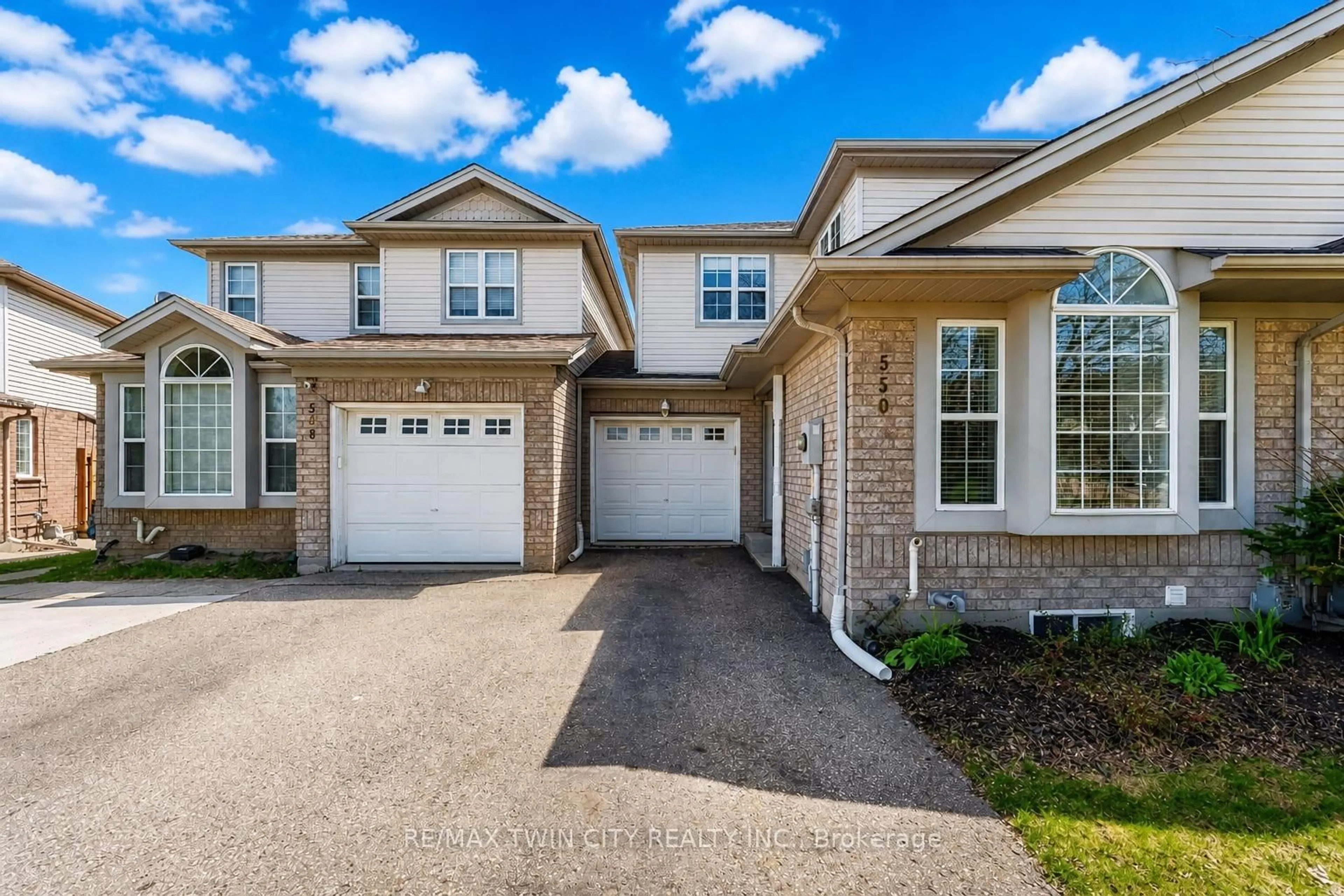 Home with brick exterior material, street for 550 Dansbury Dr, Waterloo Ontario N2K 4E2