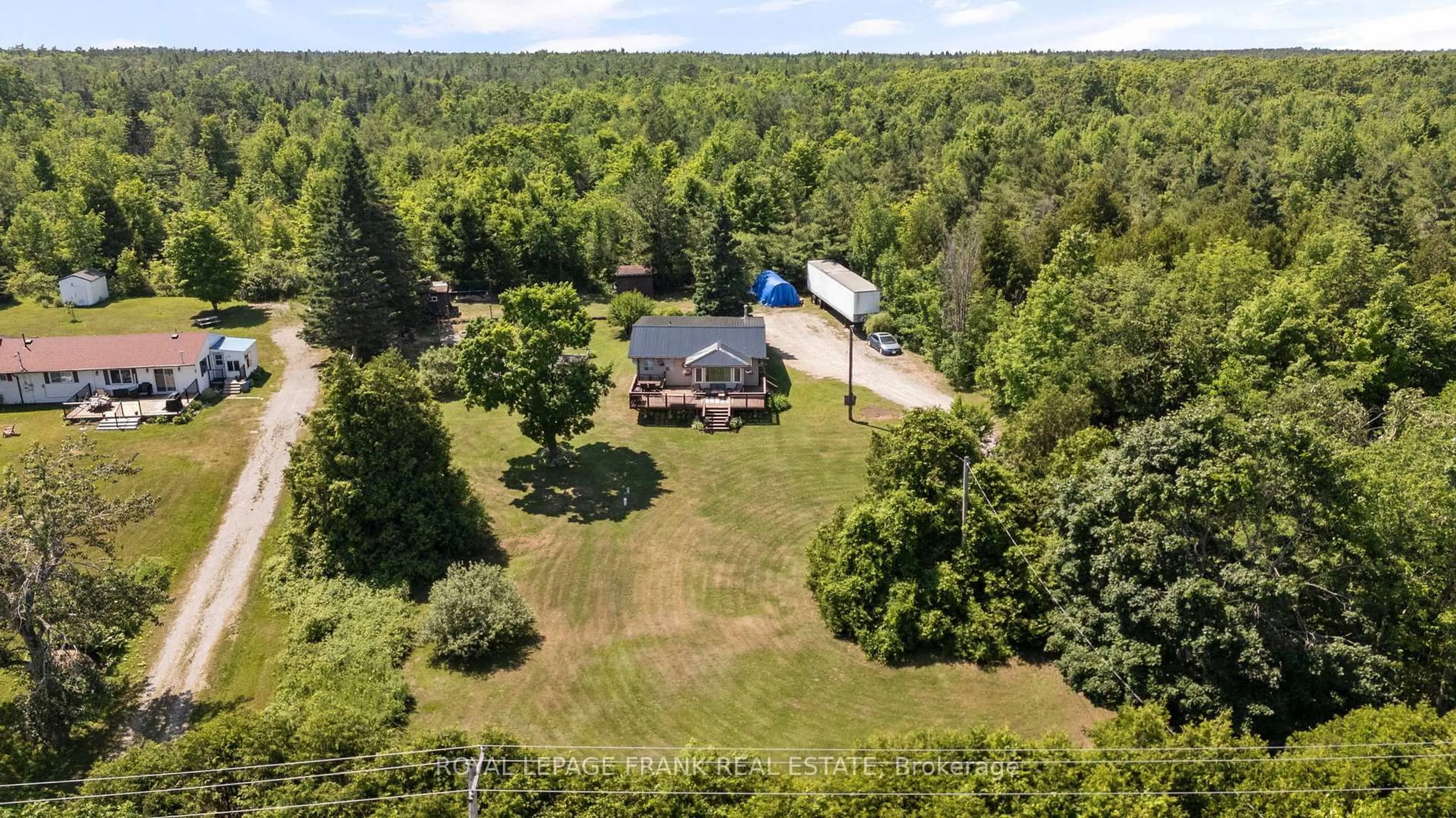 A pic from outside/outdoor area/front of a property/back of a property/a pic from drone, forest/trees view for 2378 Monck Rd, Kawartha Lakes Ontario K0M 2B0
