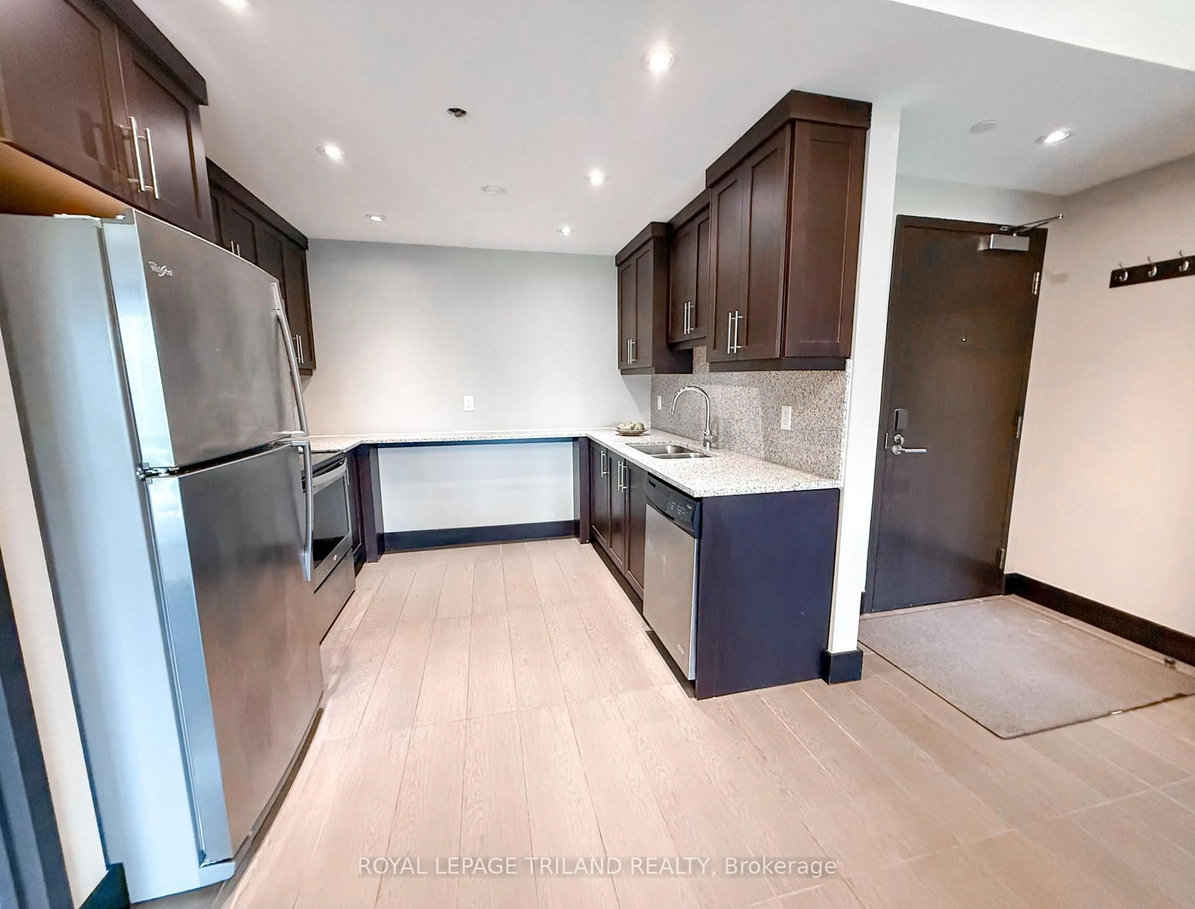 Open concept kitchen, wood/laminate floor for 1235 Richmond St #607, London East Ontario N6A 0C1