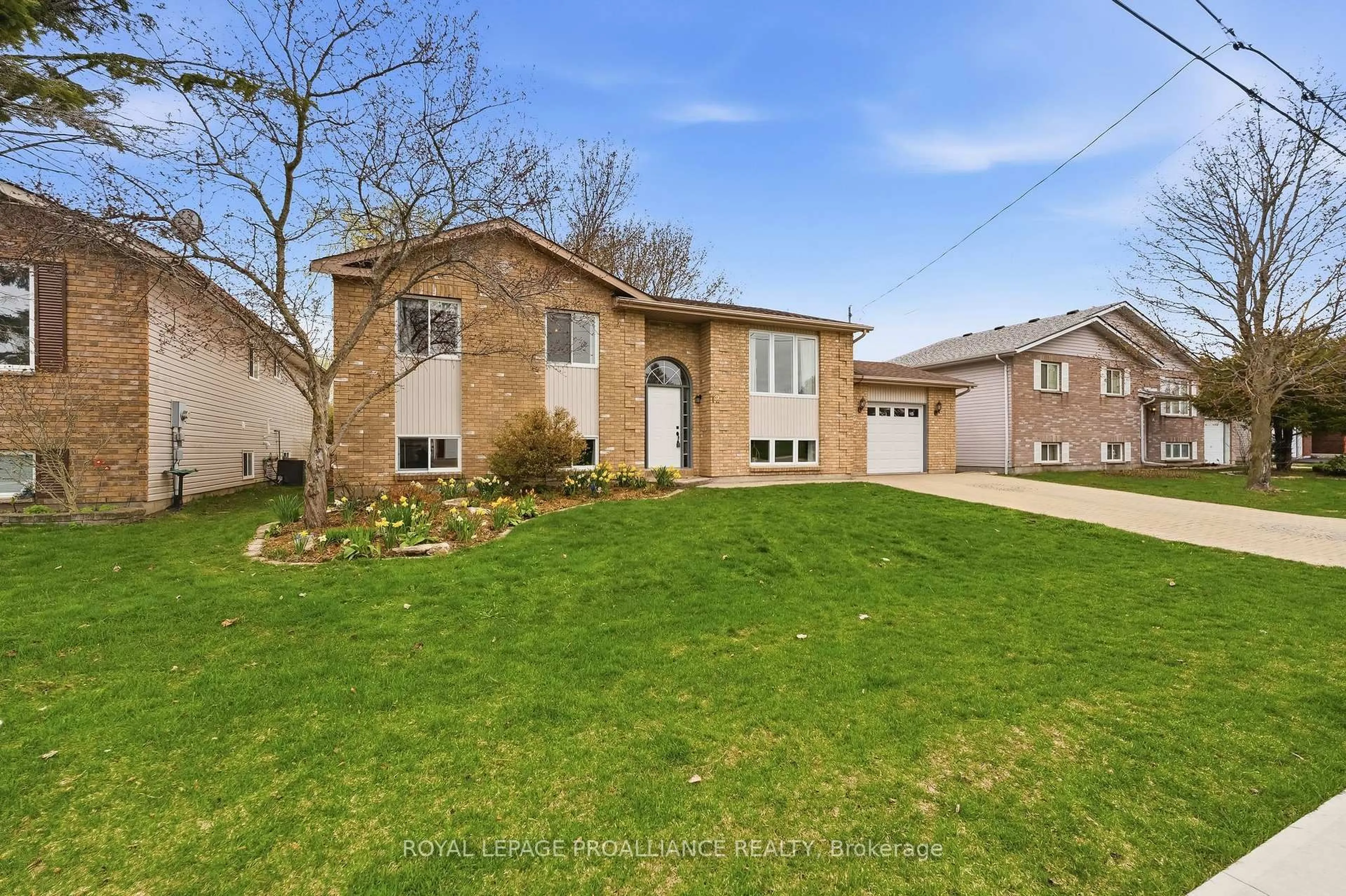 Home with brick exterior material, street for 12 Marina Dr, Brighton Ontario K0K 1H0