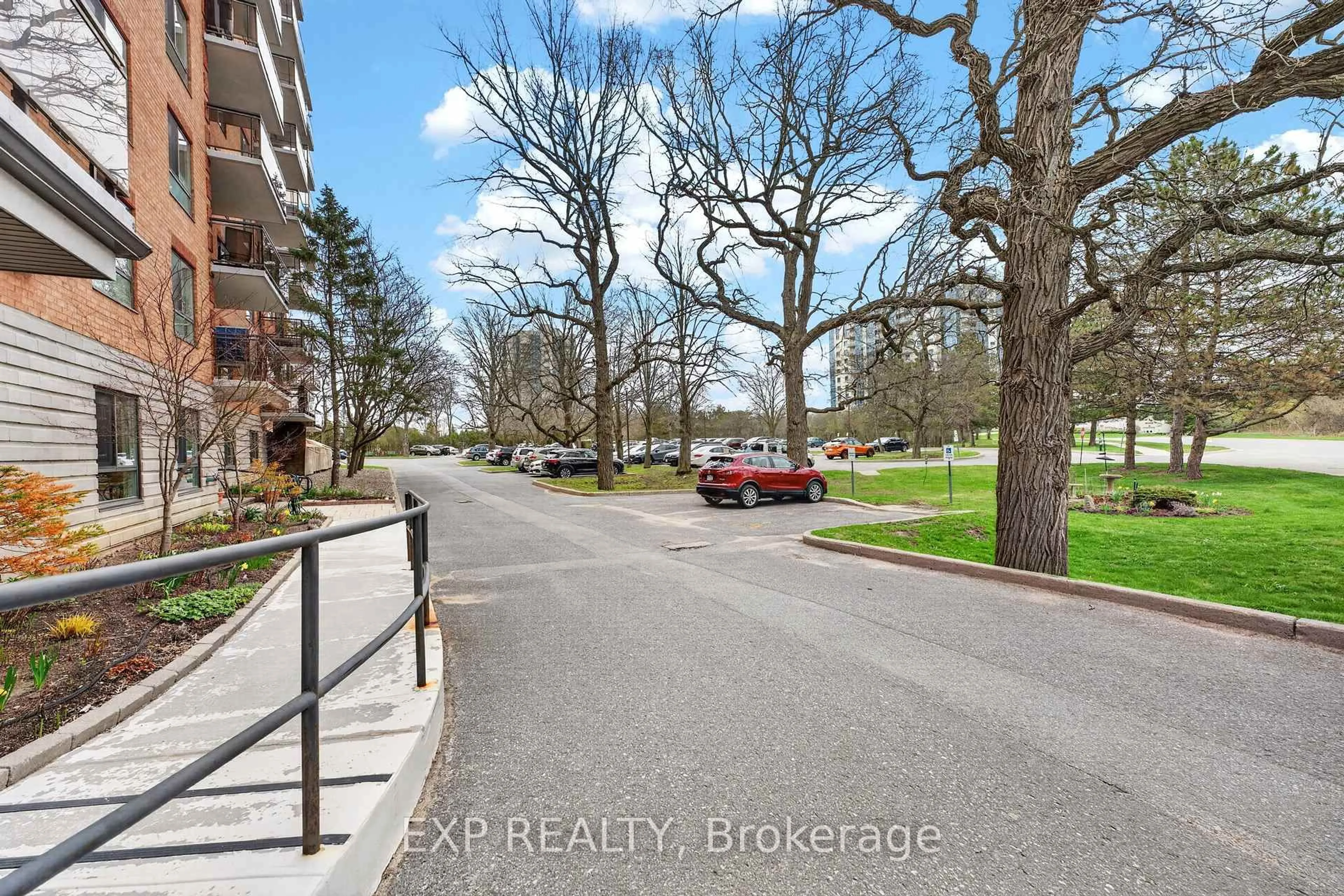 A pic from outside/outdoor area/front of a property/back of a property/a pic from drone, street for 115 Barrett Crt #201, Kingston Ontario K7L 5H6