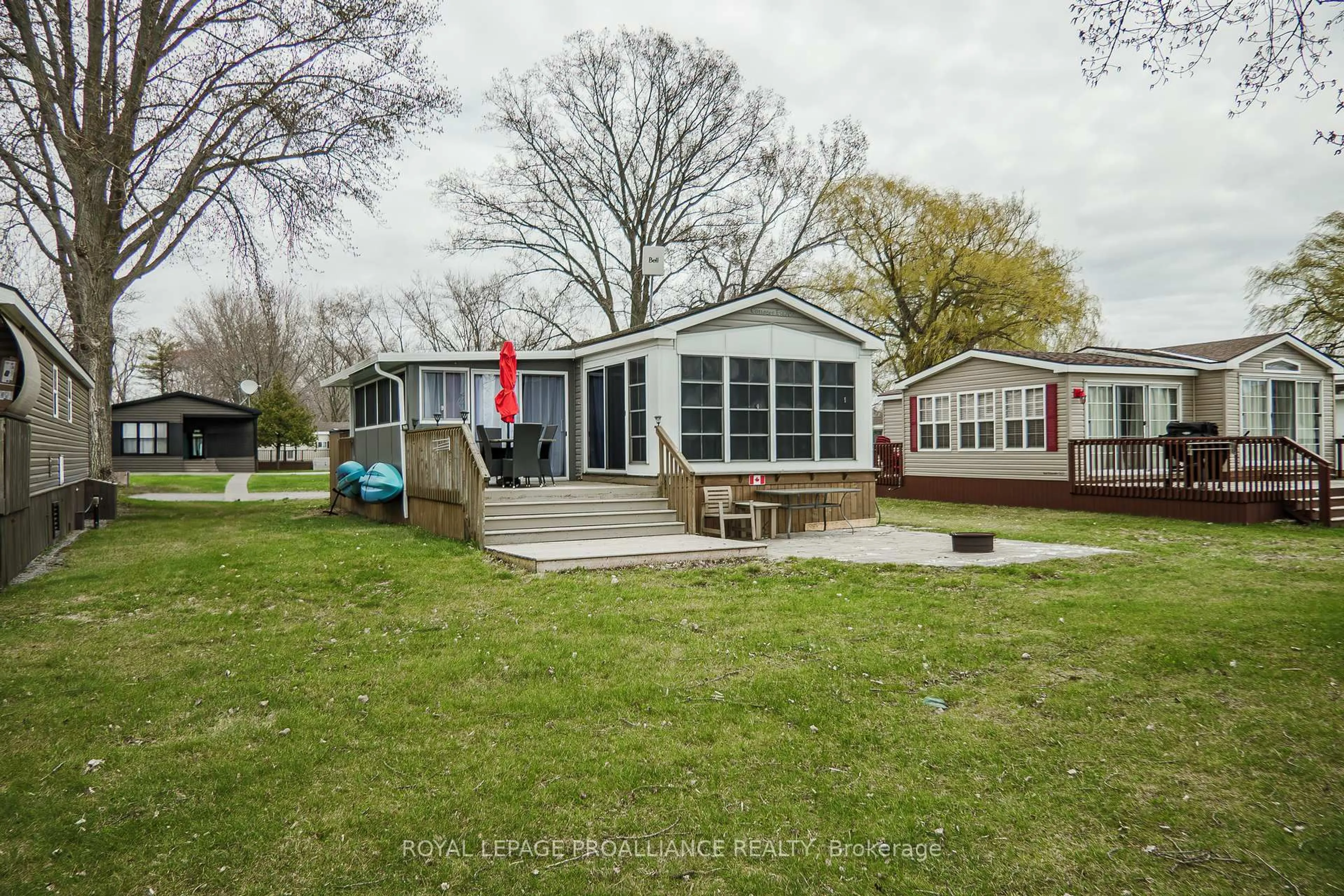 A pic from outside/outdoor area/front of a property/back of a property/a pic from drone, water/lake/river/ocean view for 486 County Rd 1 19 Beachview Lane, Prince Edward County Ontario K0K 2T0