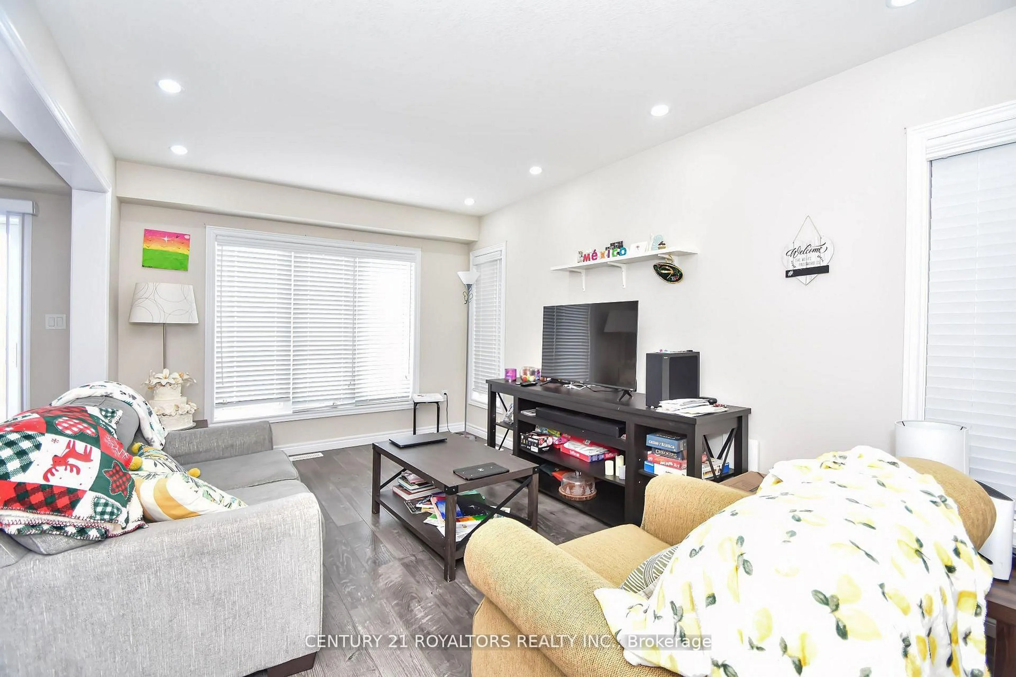 Living room with furniture, wood/laminate floor for 1584 Dunkirk Ave, Woodstock Ontario N4T 0L1