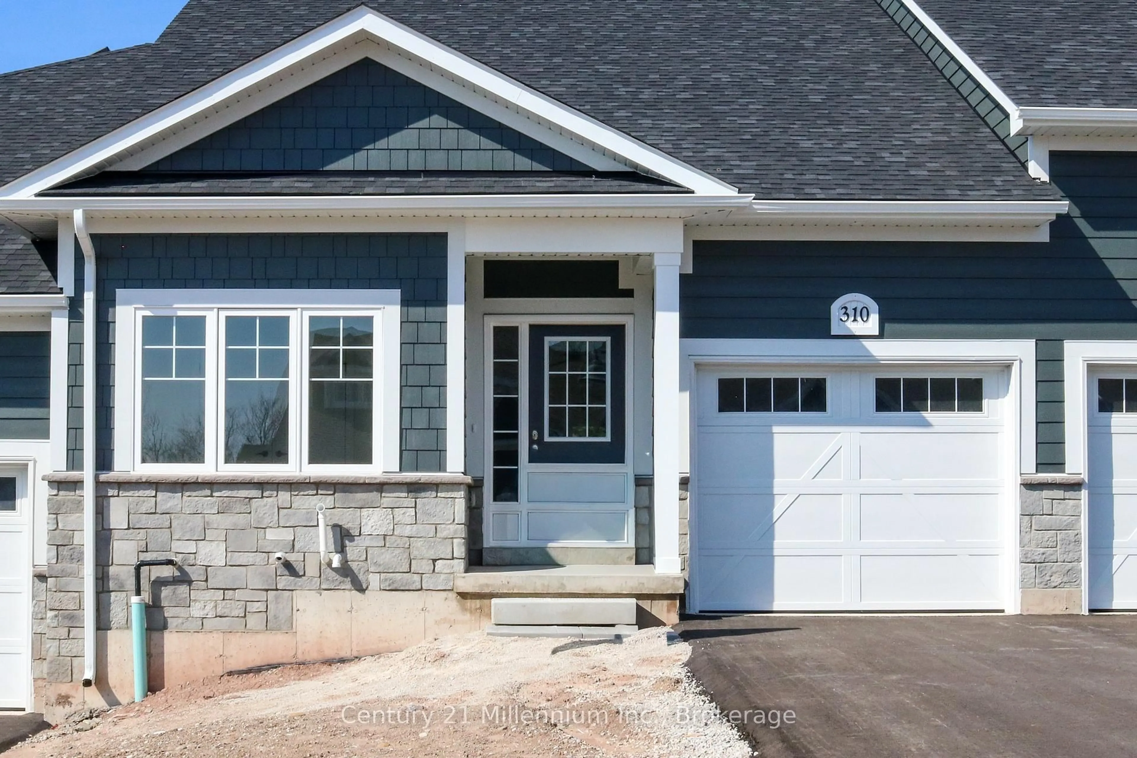 Home with vinyl exterior material, street for 310 Telford Tr, Georgian Bluffs Ontario N0H 1S0