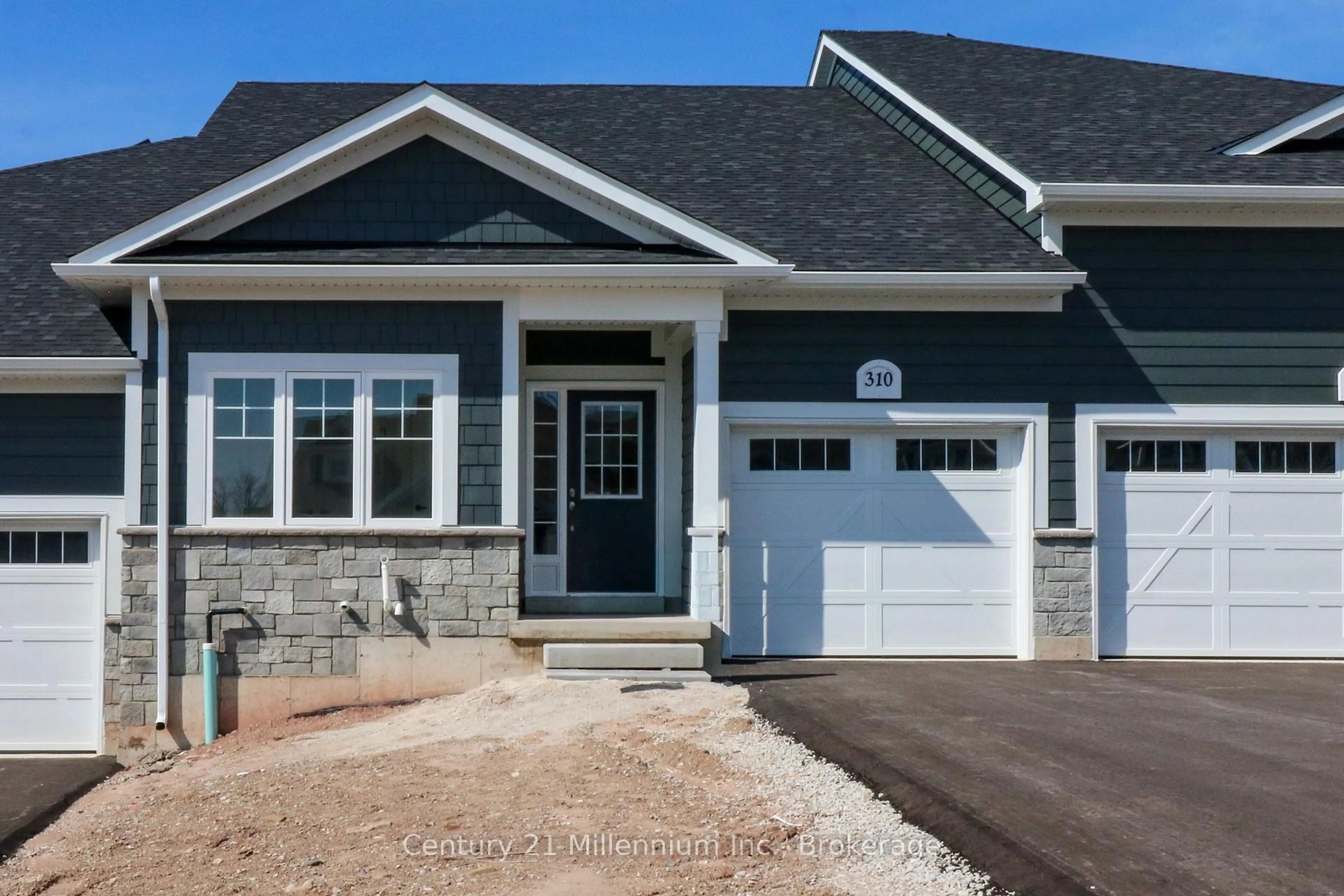 Home with vinyl exterior material, street for 310 Telford Tr, Georgian Bluffs Ontario N0H 1S0