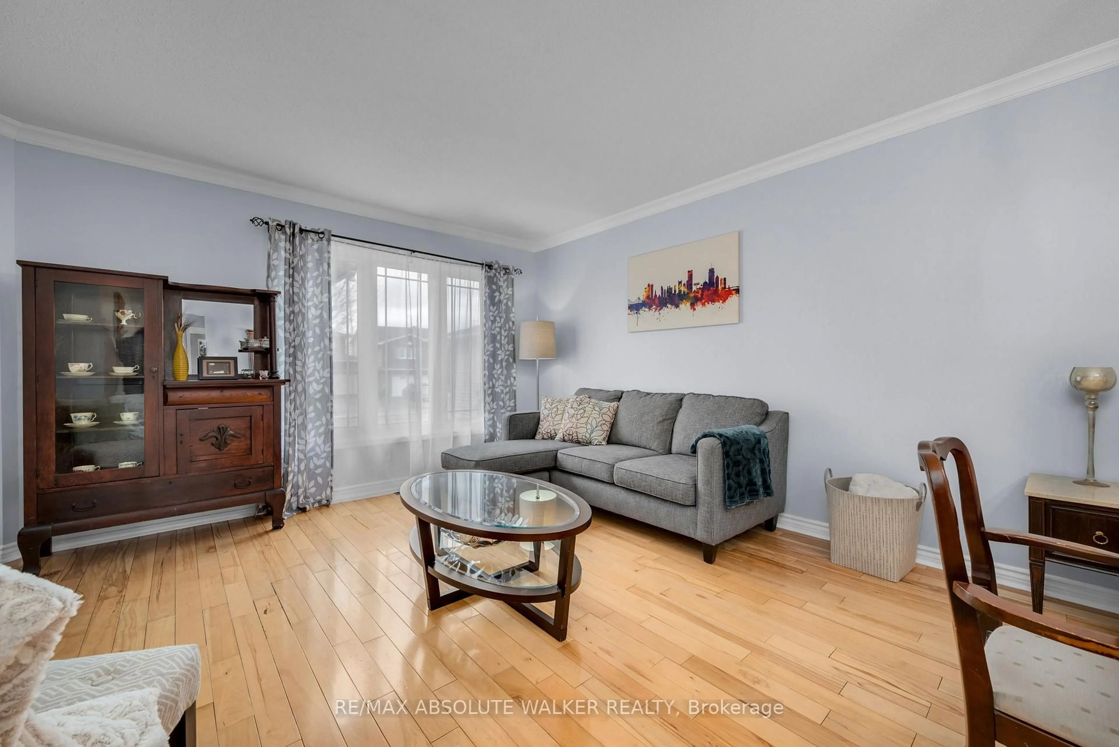 Living room with furniture, wood/laminate floor for 2061 Legrand Cres, Ottawa Ontario K1E 3R1