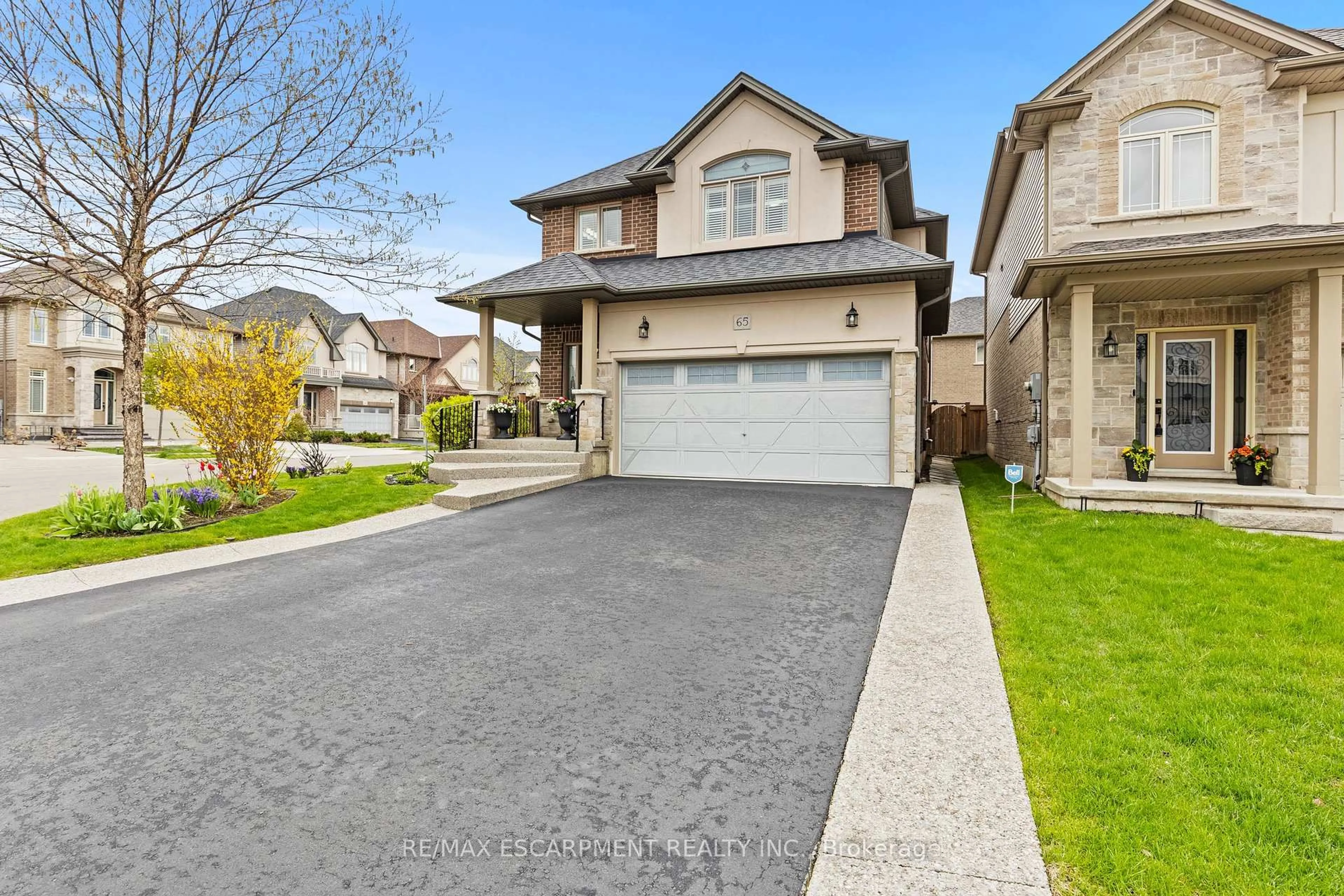 Home with vinyl exterior material, street for 65 Winslow Way, Hamilton Ontario L8J 0G9