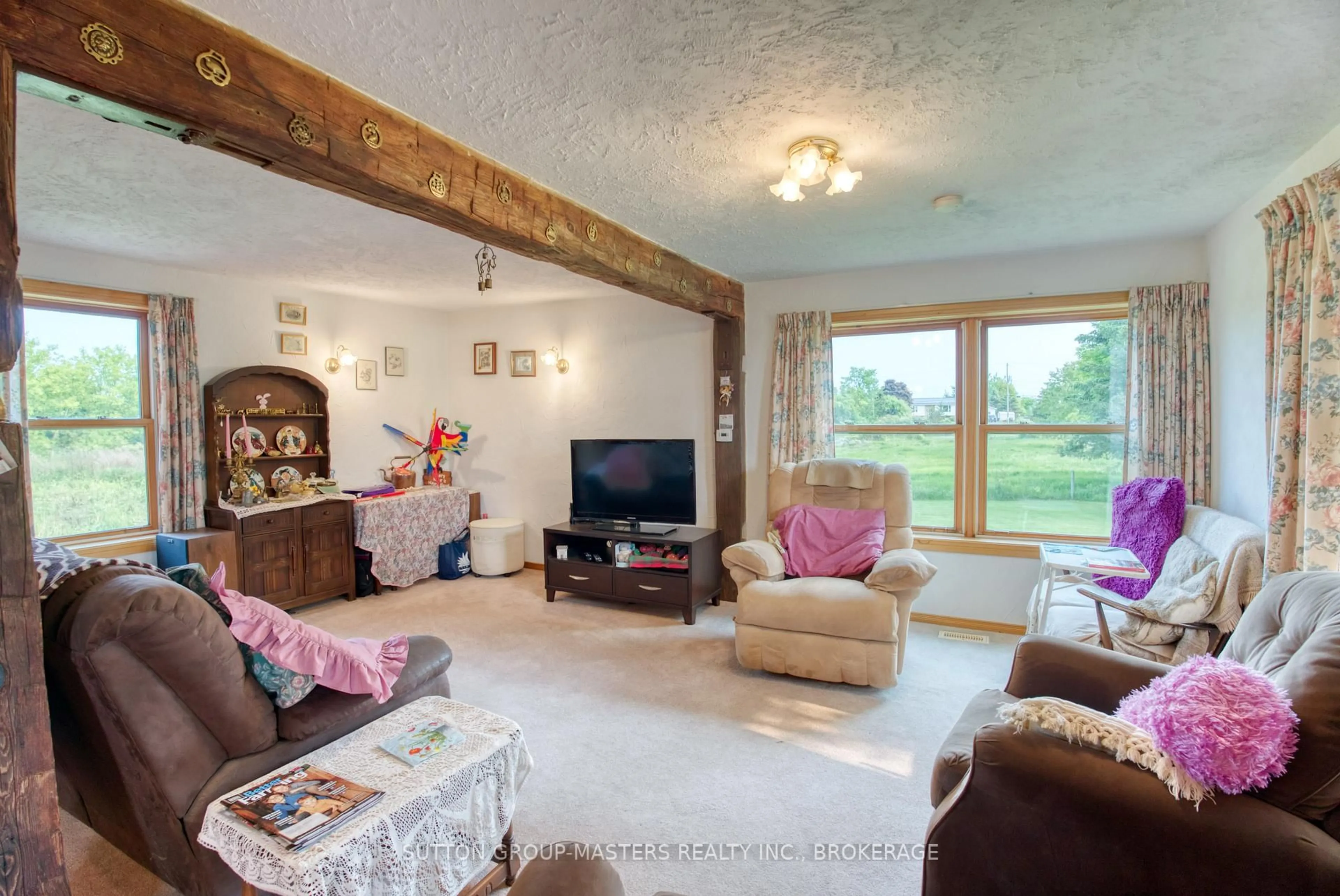 Living room with furniture, wood/laminate floor for 1329 Eden Grove Rd, Front of Leeds & Seeleys Bay Ontario K0E 1L0