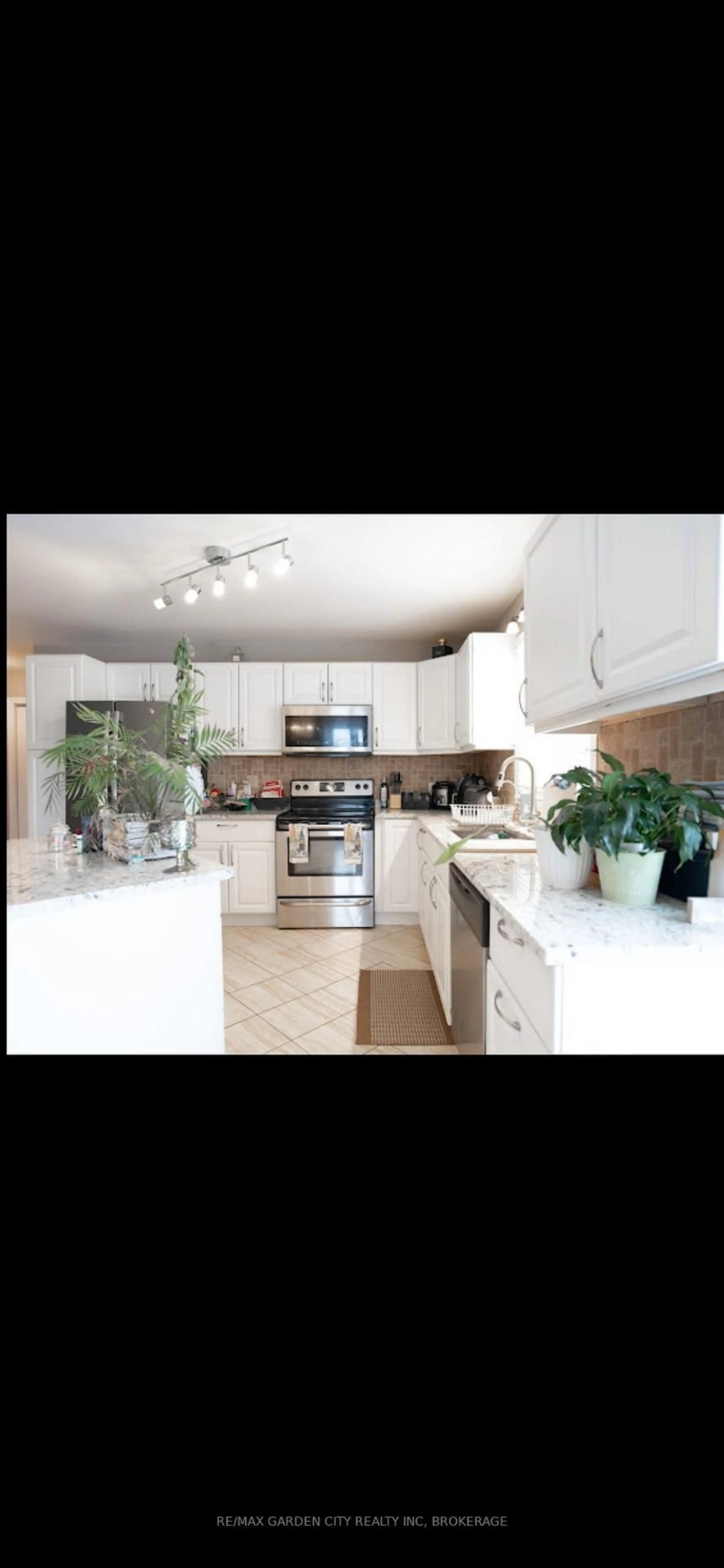 Open concept kitchen, ceramic/tile floor for 7370 Monastery Dr #4, Niagara Falls Ontario L2H 3C4