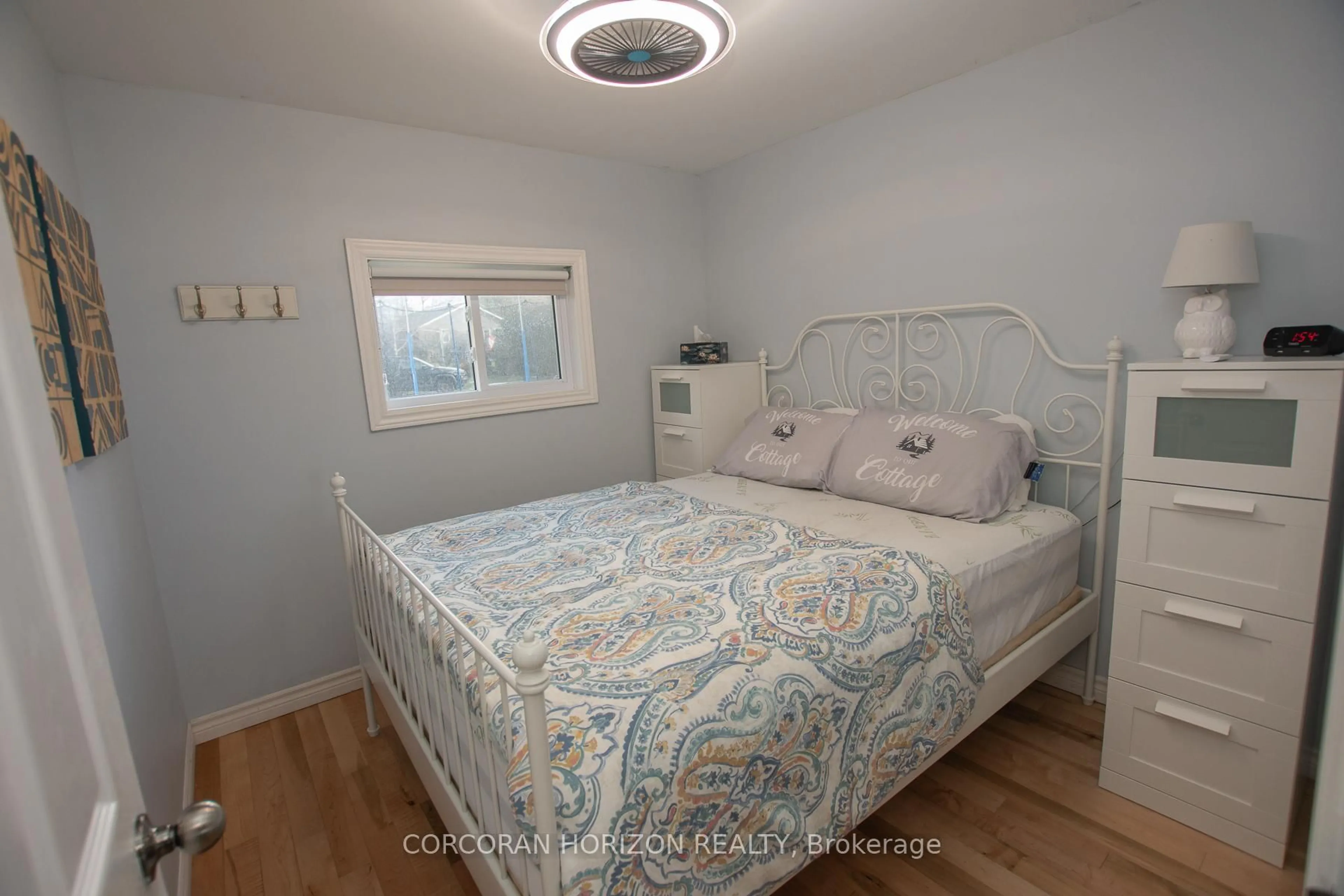 Bedroom with bed, wood/laminate floor for 409 Marble Point Rd, Limoges Ontario K0K 2M0