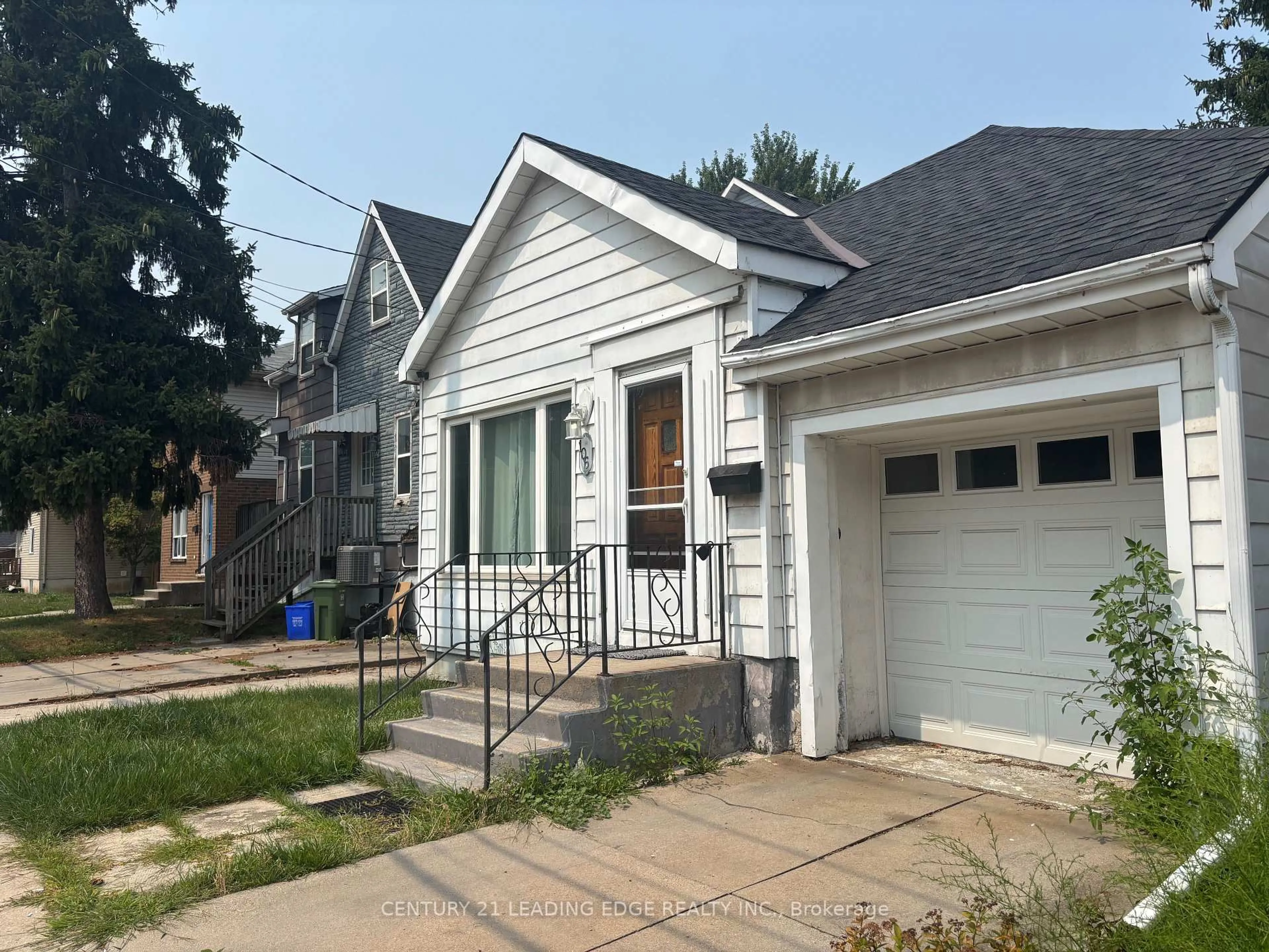 Home with vinyl exterior material, street for 106 Whitney Ave, Hamilton Ontario L8S 2G5