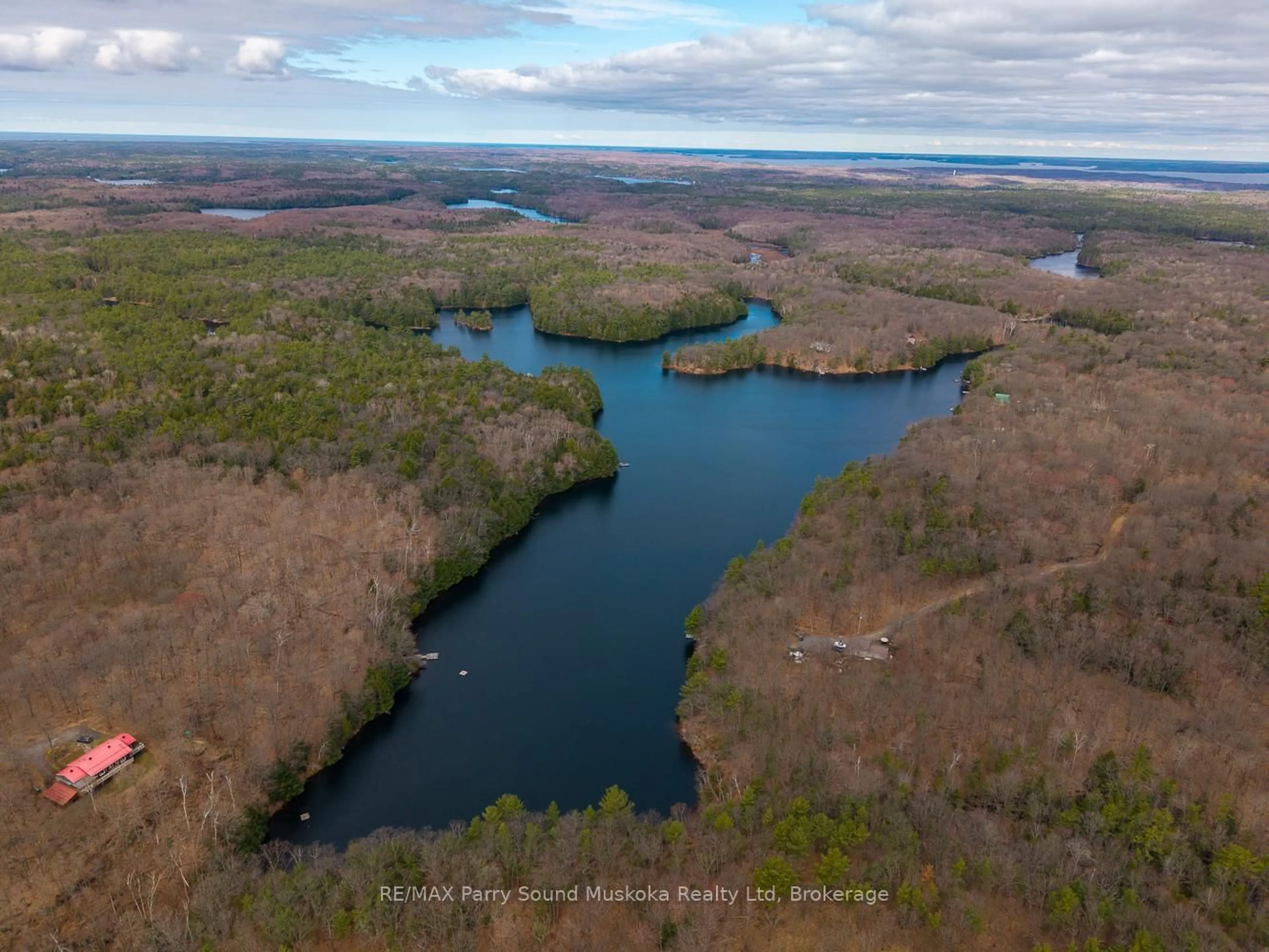 A pic from outside/outdoor area/front of a property/back of a property/a pic from drone, water/lake/river/ocean view for 30 Dog Leg Path, Seguin Ontario P2A 0B2