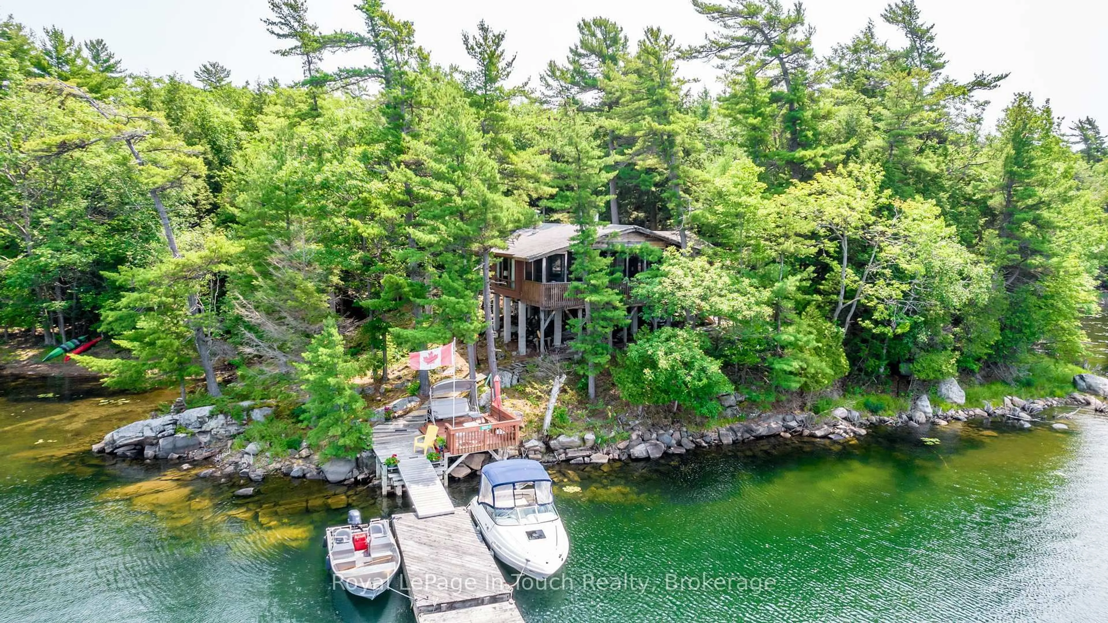A pic from outside/outdoor area/front of a property/back of a property/a pic from drone, water/lake/river/ocean view for B207-7 WAHSOUNE Island, The Archipelago Ontario P2A 0B7