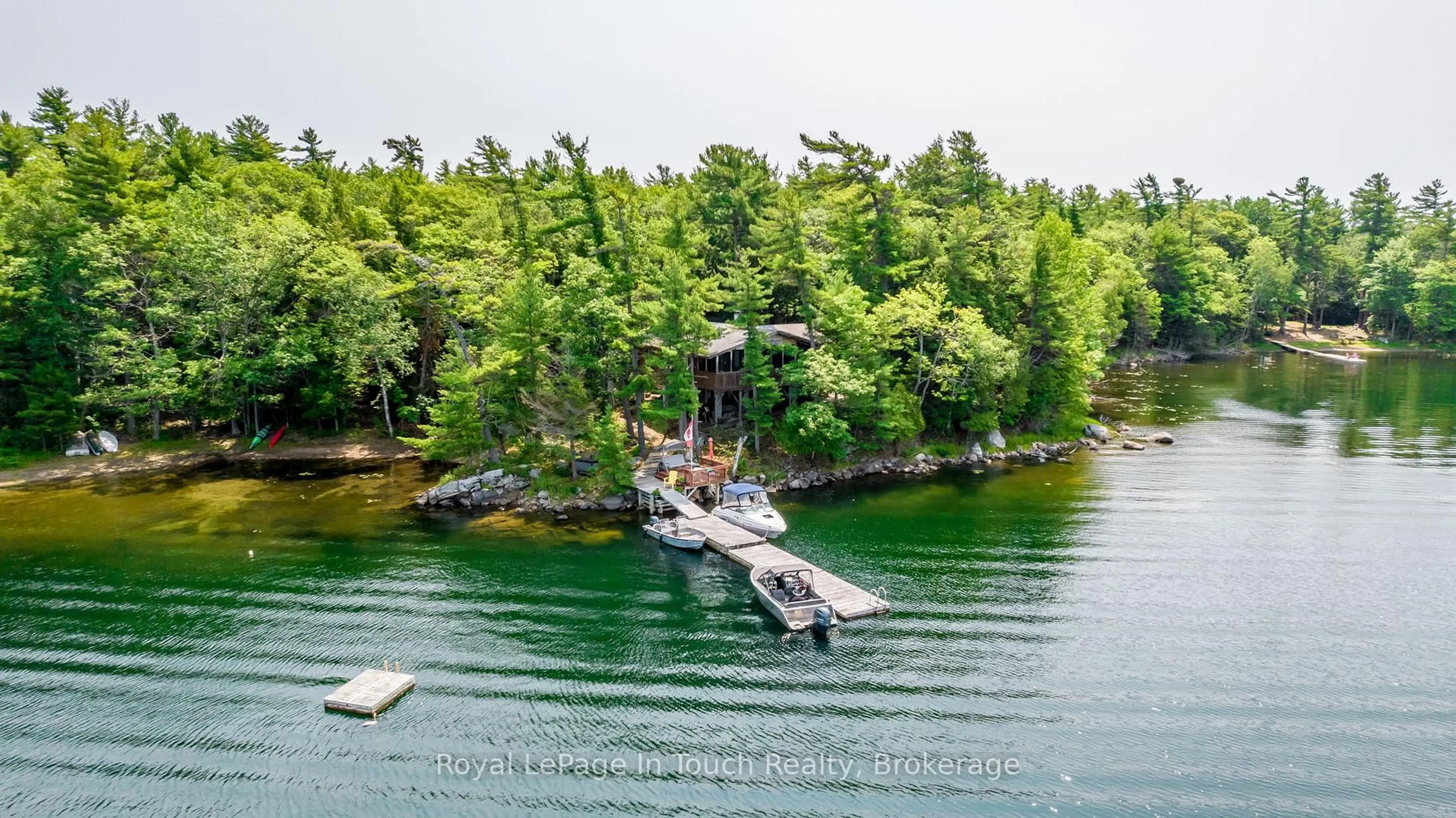 A pic from outside/outdoor area/front of a property/back of a property/a pic from drone, water/lake/river/ocean view for B207-7 WAHSOUNE Island, The Archipelago Ontario P2A 0B7