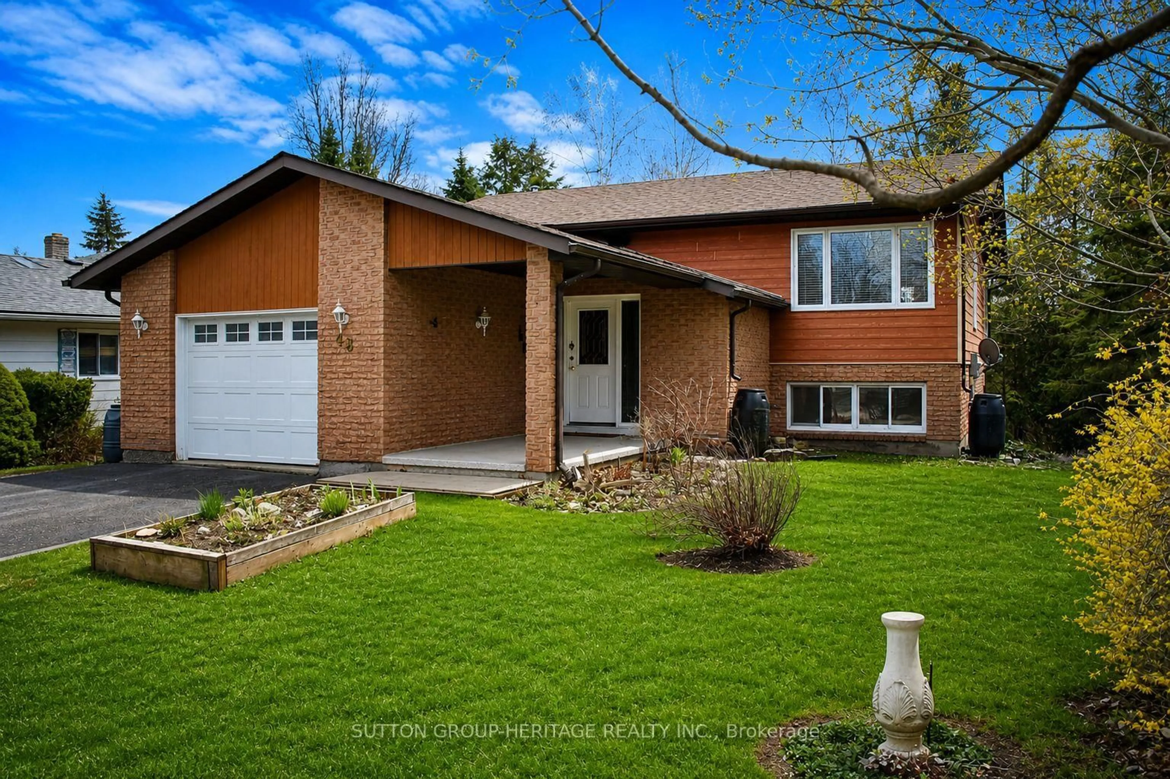 Home with brick exterior material, street for 48 CEDARTREE Lane, Kawartha Lakes Ontario K0M 1A0
