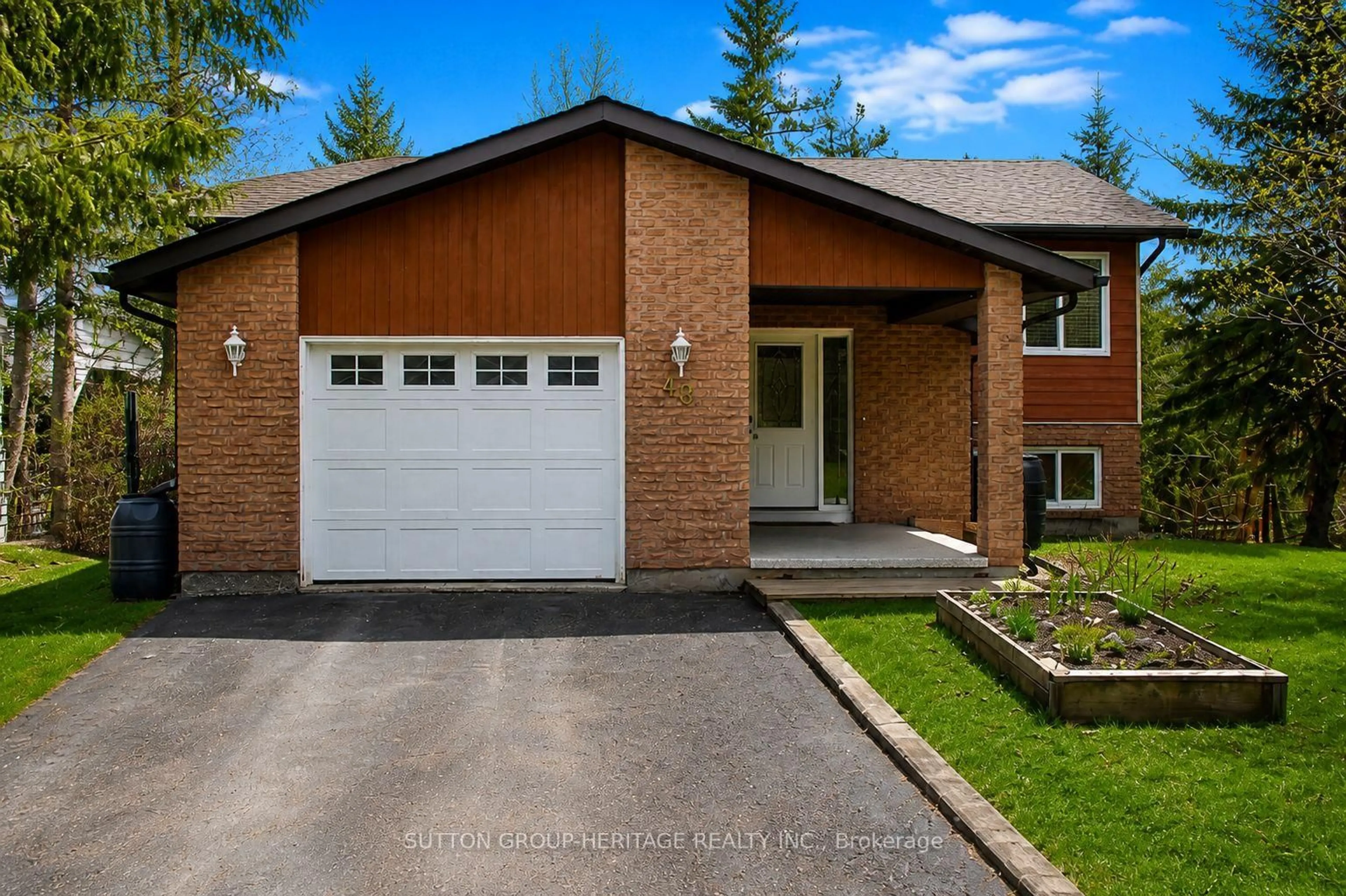 Home with brick exterior material, street for 48 CEDARTREE Lane, Kawartha Lakes Ontario K0M 1A0