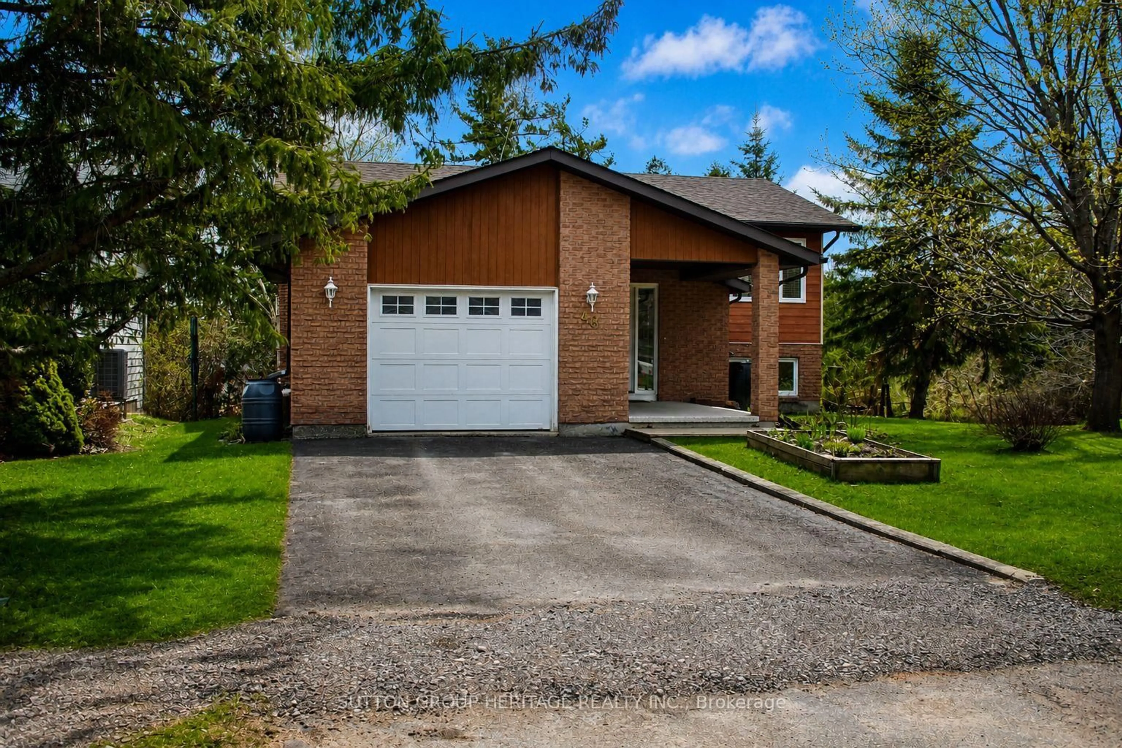 Home with brick exterior material, street for 48 CEDARTREE Lane, Kawartha Lakes Ontario K0M 1A0