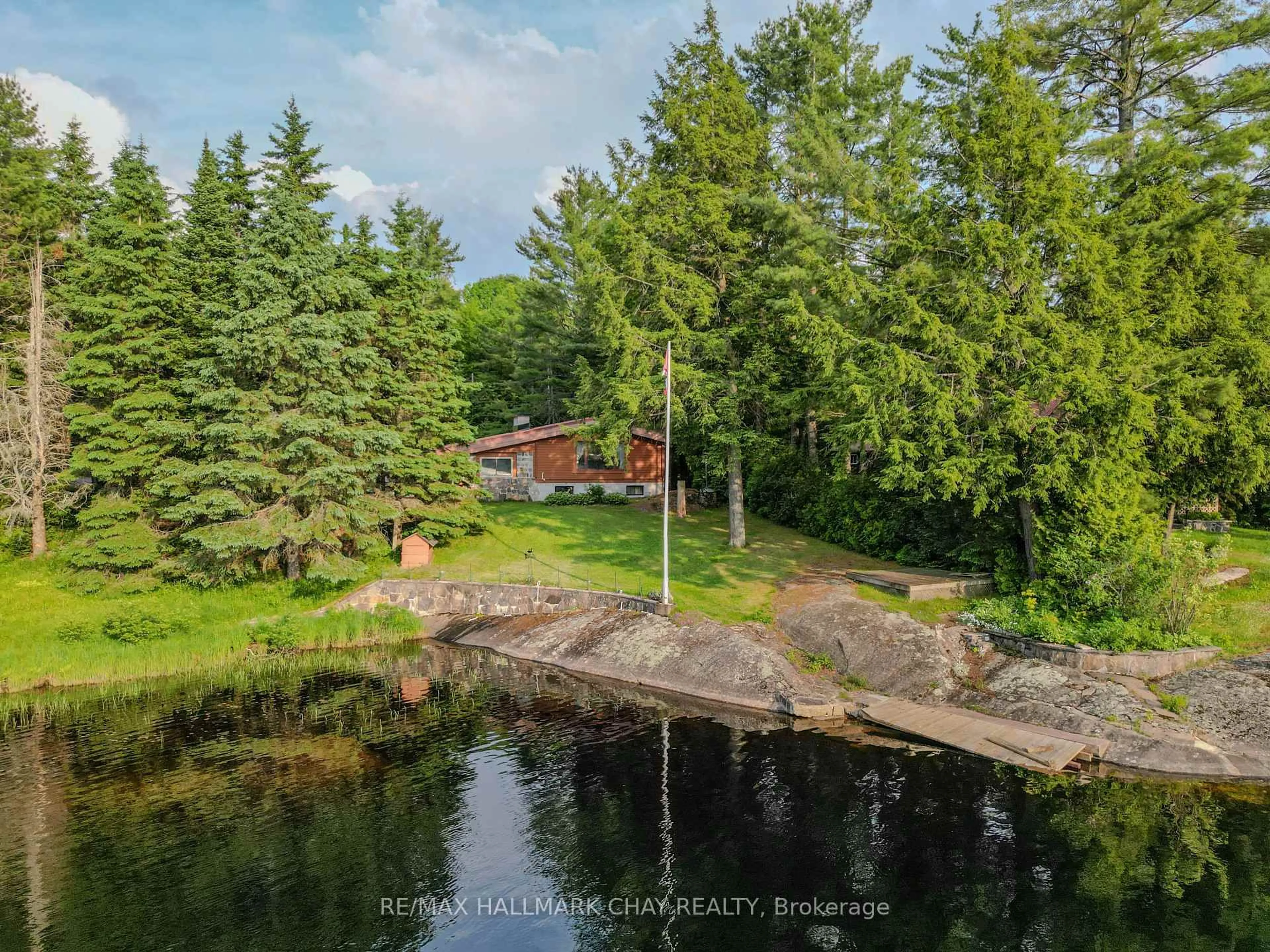 A pic from outside/outdoor area/front of a property/back of a property/a pic from drone, water/lake/river/ocean view for 1070 Chaikof Rd, Bracebridge Ontario P1P 1R3