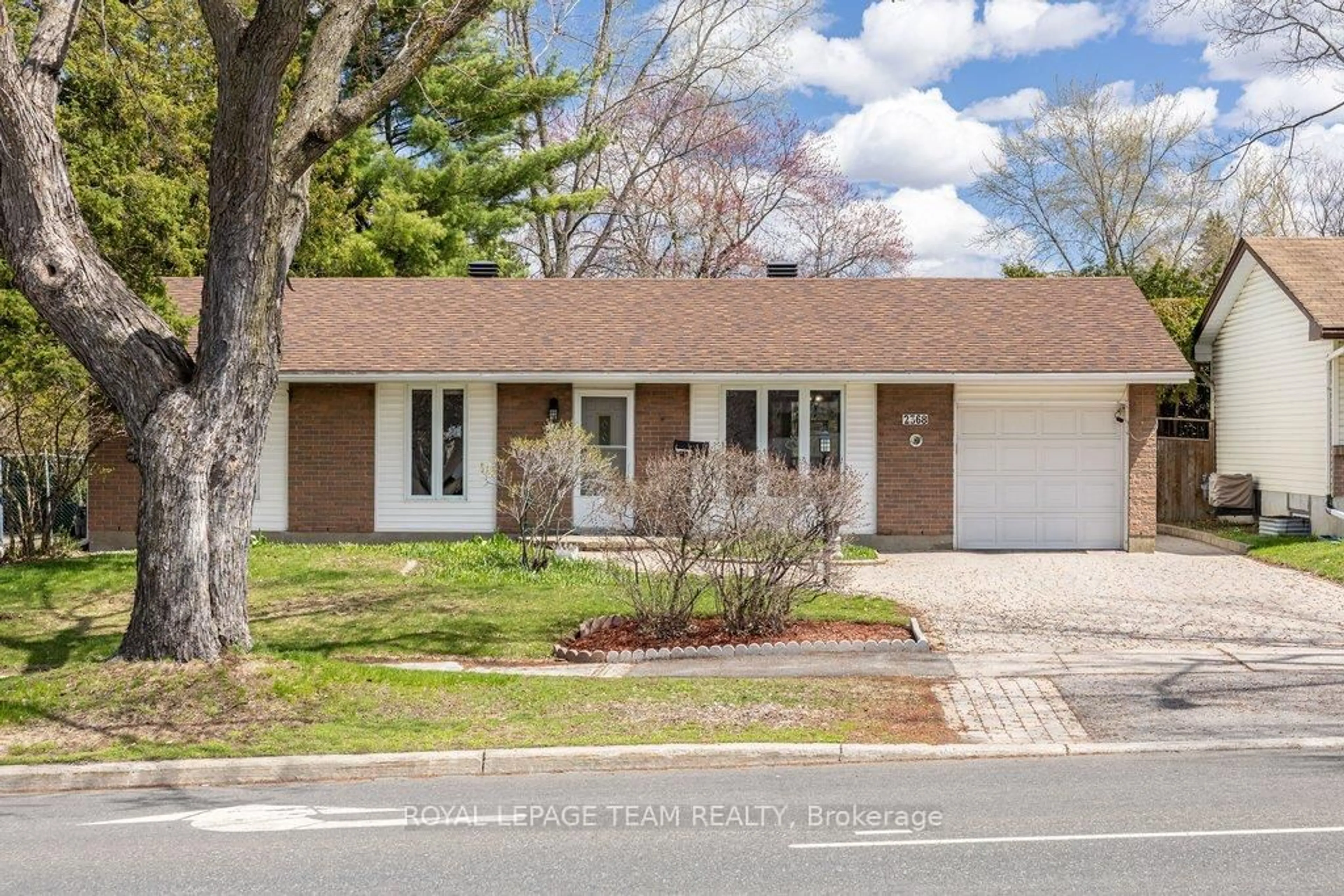 Home with brick exterior material, street for 2368 Ogilvie Rd, Ottawa Ontario K1J 7N6