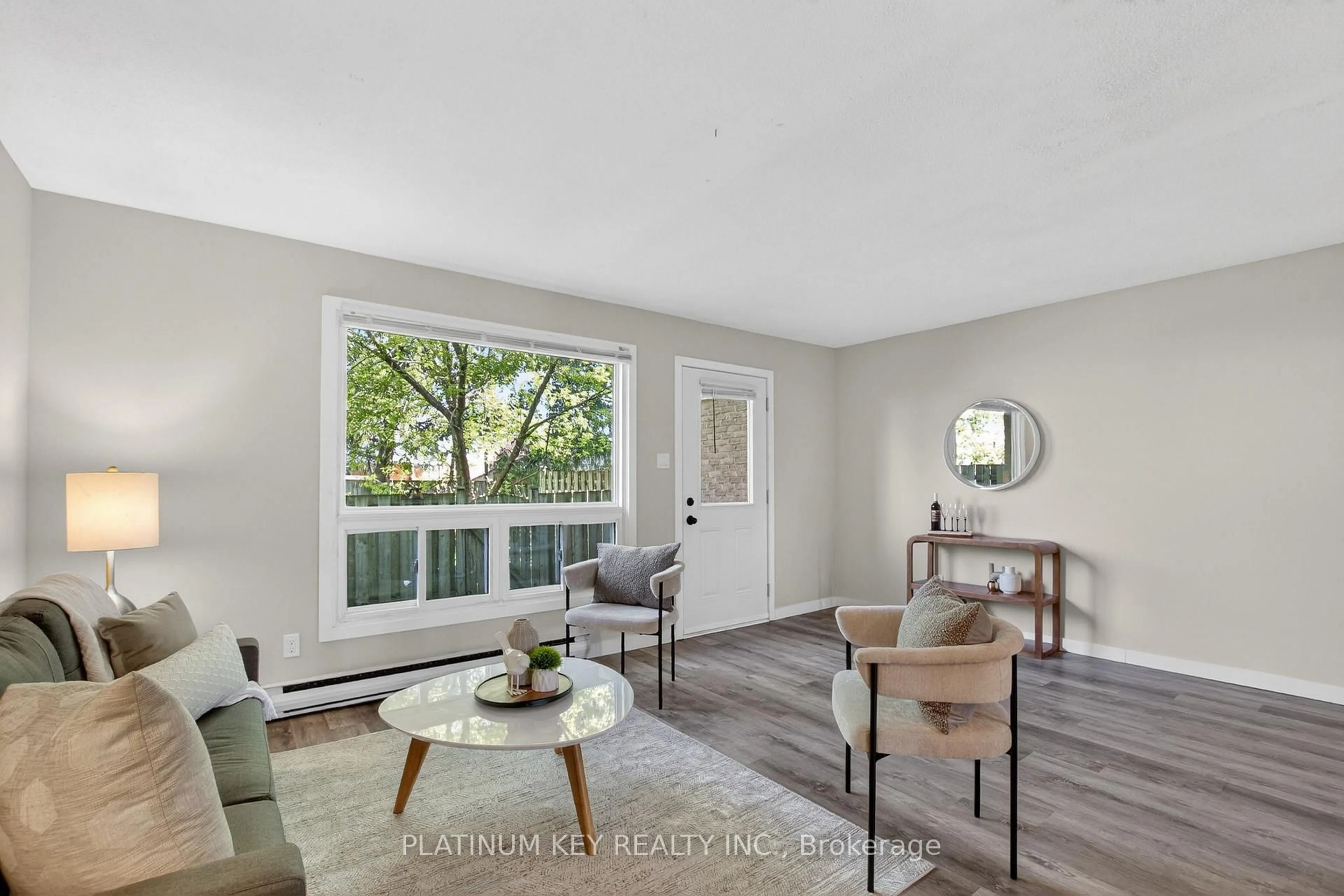 Living room with furniture, wood/laminate floor for 1600 Culver Dr #82, London East Ontario N5V 3H5
