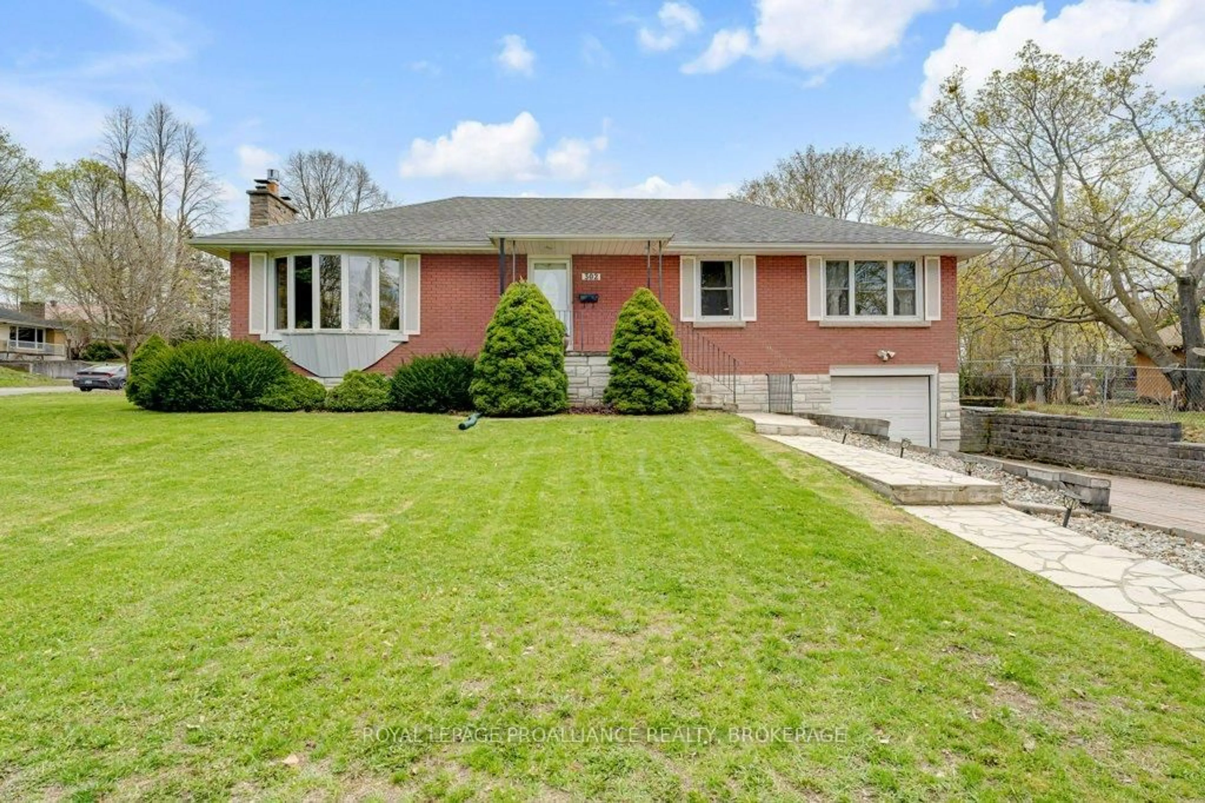Home with brick exterior material, street for 302 Arrowhead Pl, Kingston Ontario K7M 3L3