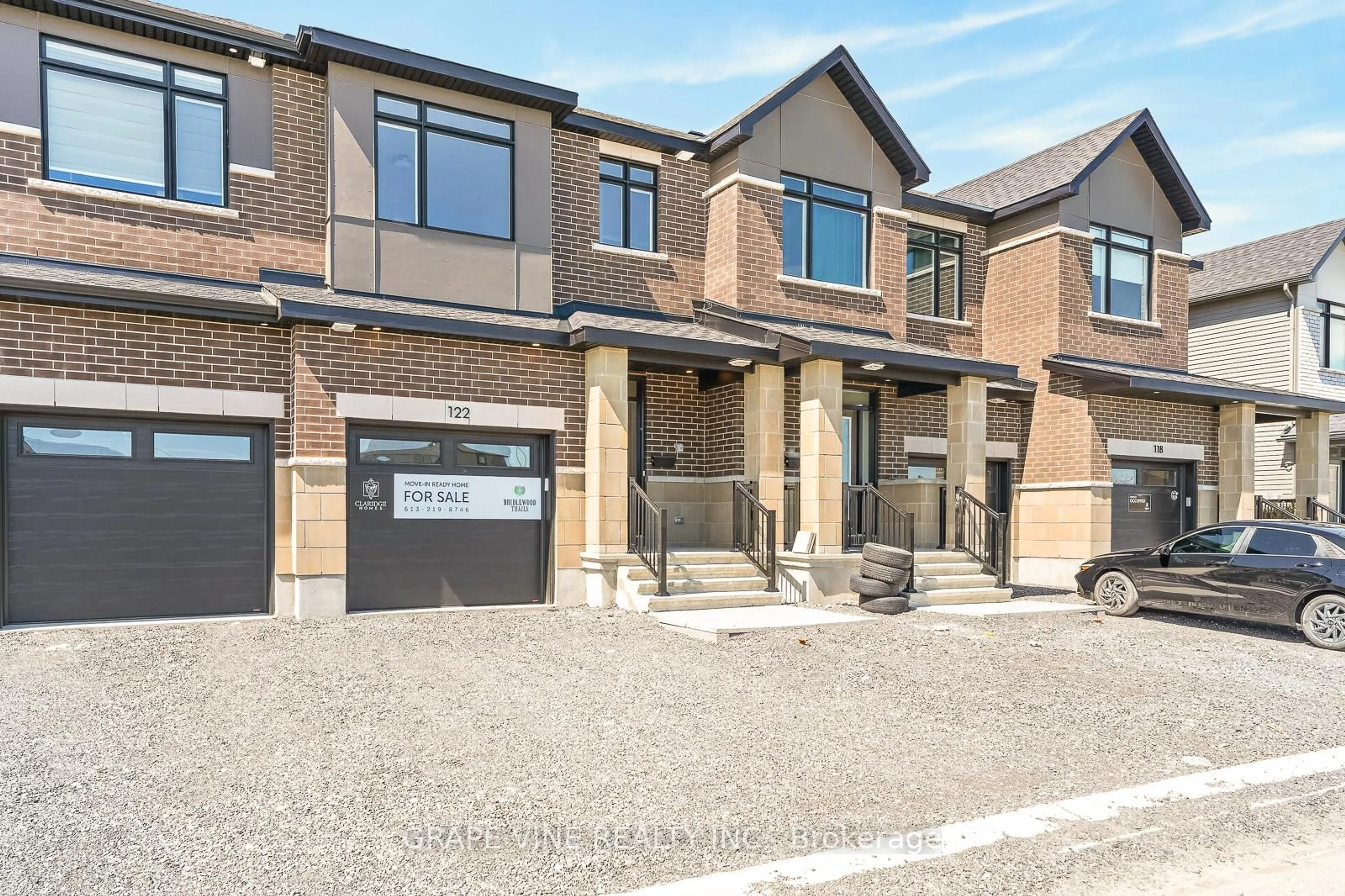 Home with brick exterior material, street for 122 San Felice Circ, Ottawa Ontario K2S 2S7