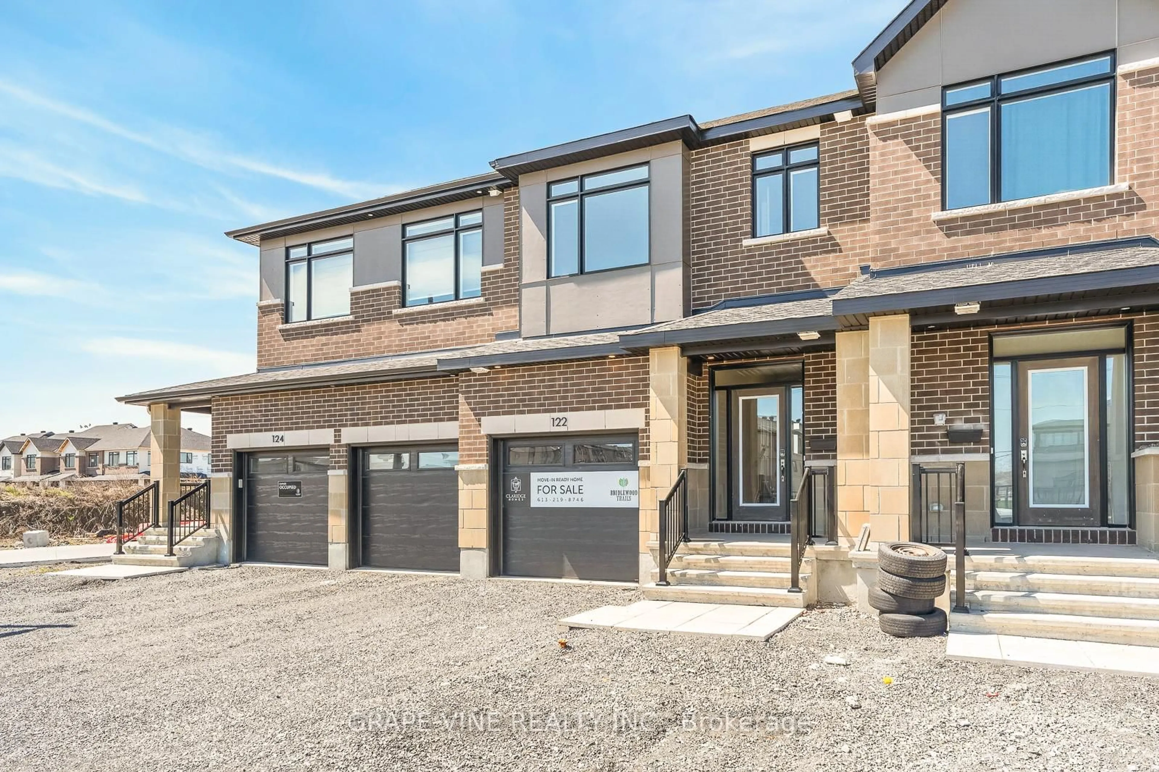 Home with brick exterior material, street for 122 San Felice Circ, Ottawa Ontario K2S 2S7