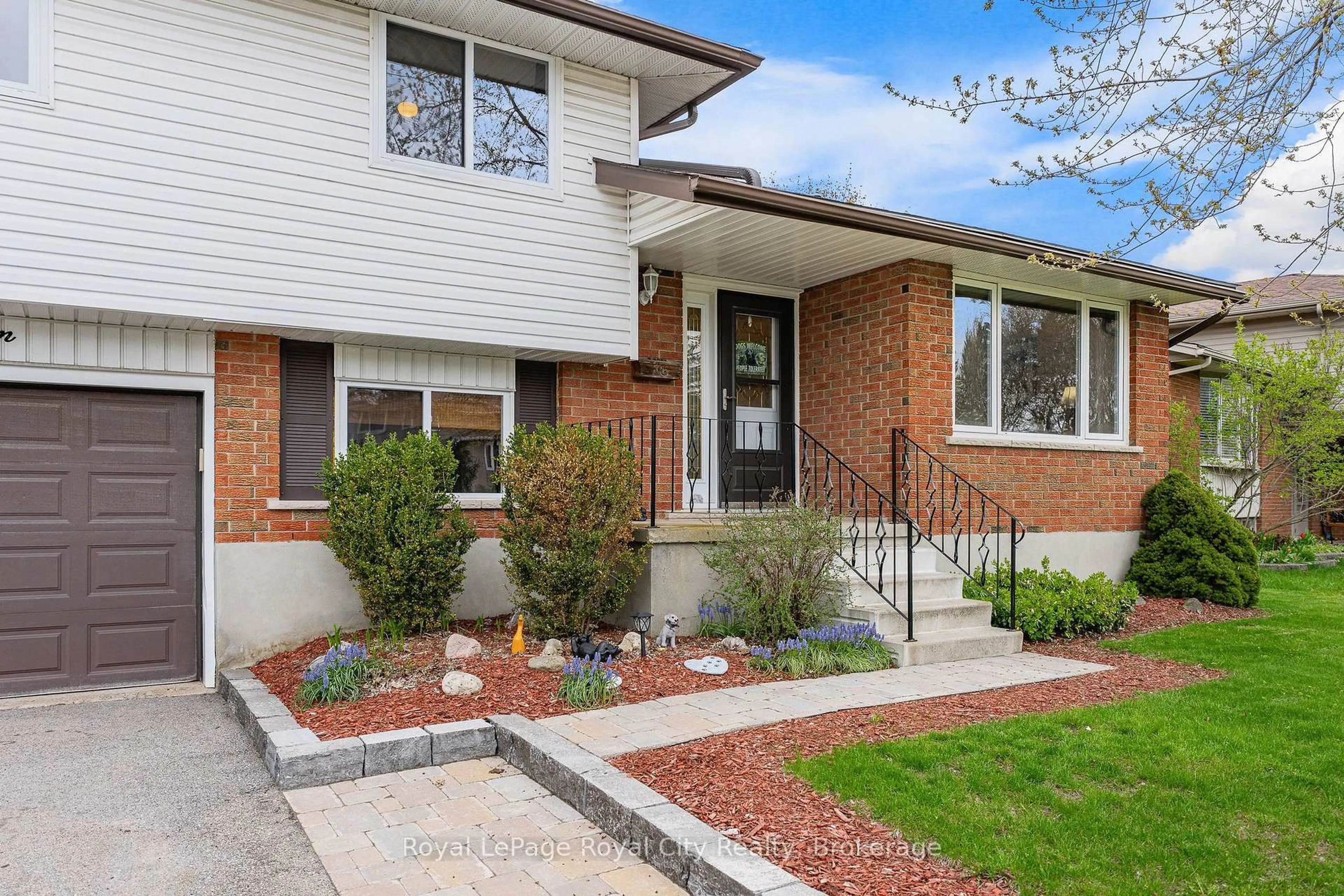 Home with brick exterior material, street for 16 Sanderson Dr, Guelph Ontario N1H 6T8