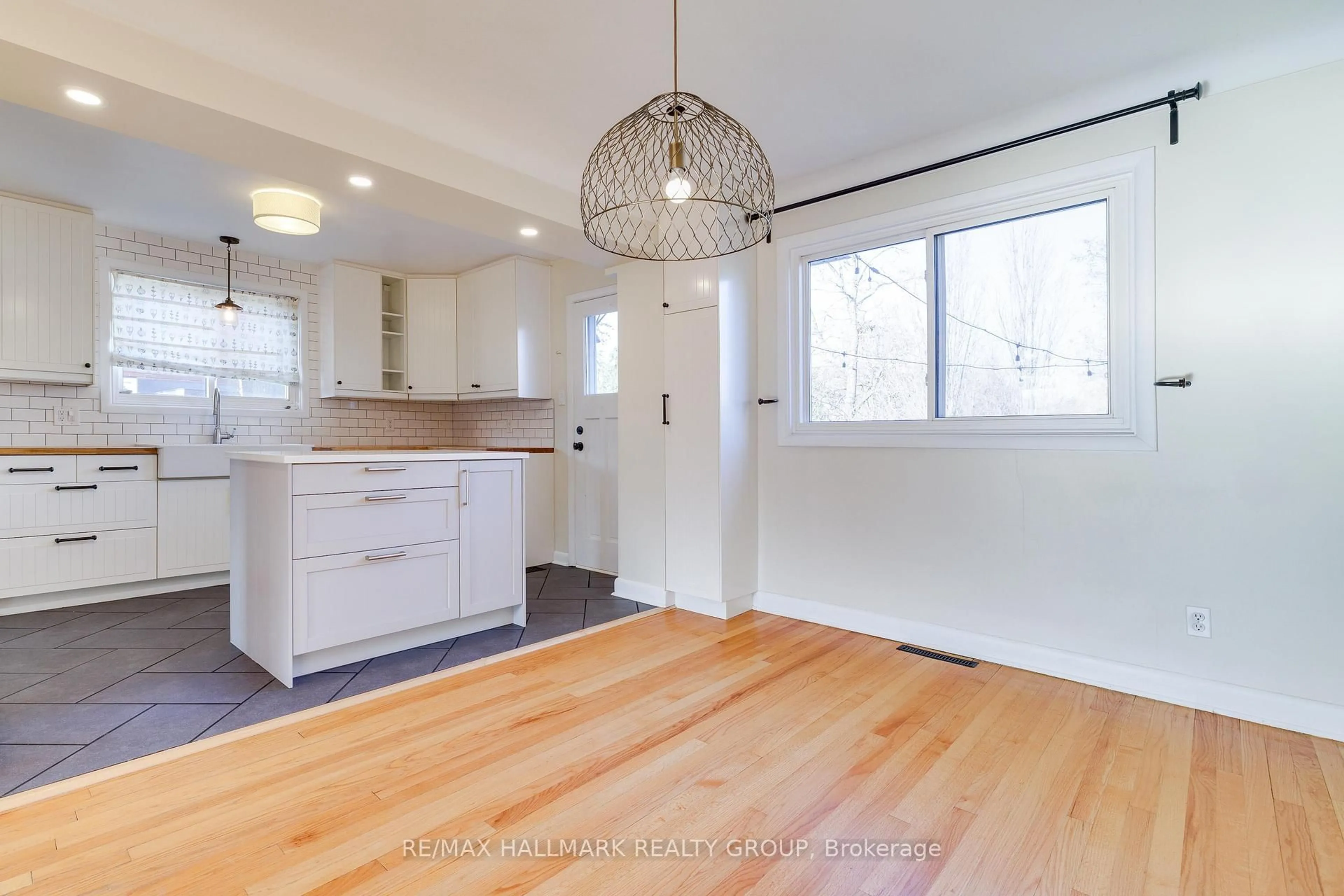 Open concept kitchen, wood/laminate floor for 1213 Emperor Ave, Ottawa Ontario K1Z 8C3