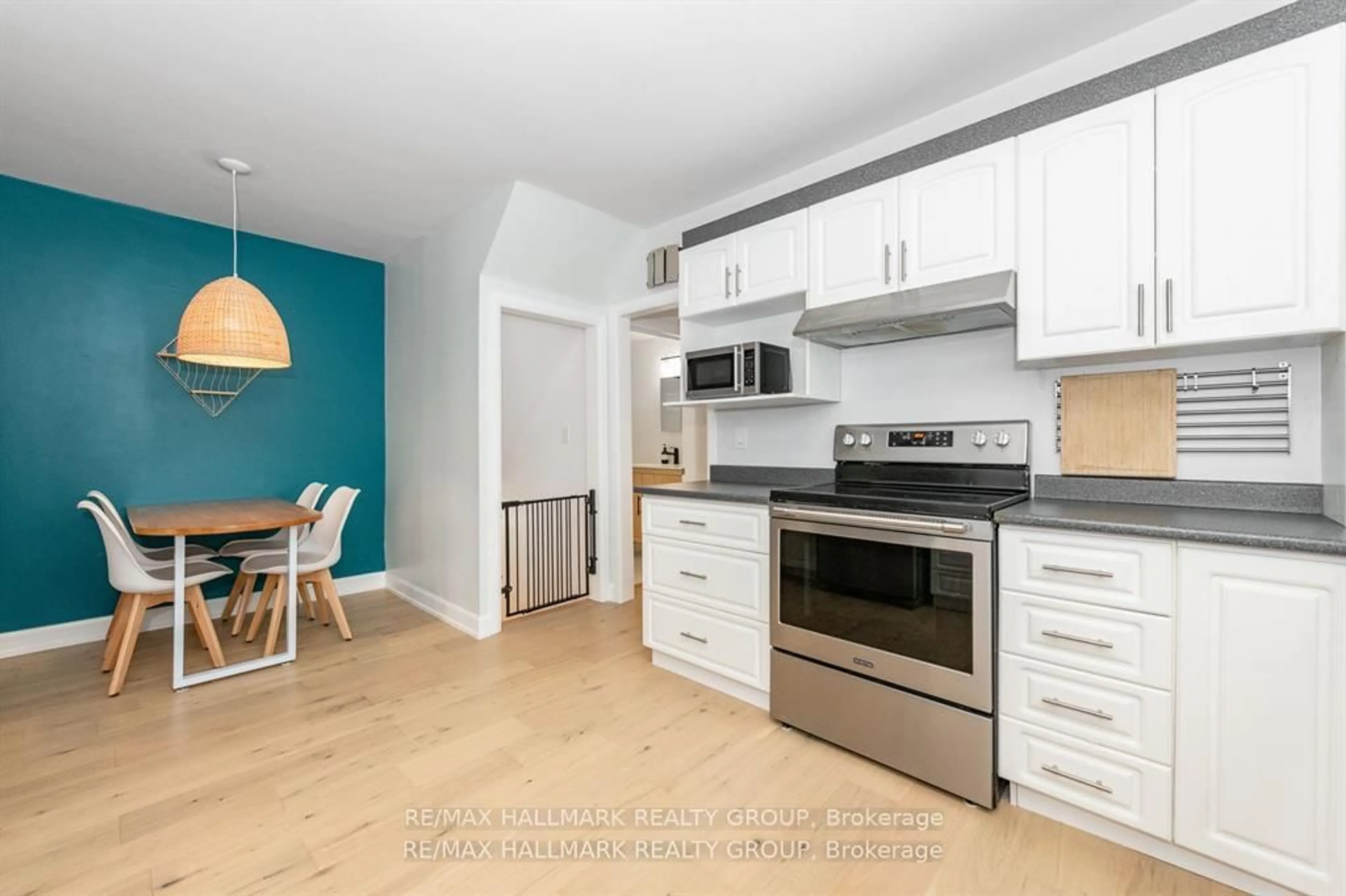 Open concept kitchen, wood/laminate floor for 324 Montfort St, Ottawa Ontario K1L 5N4