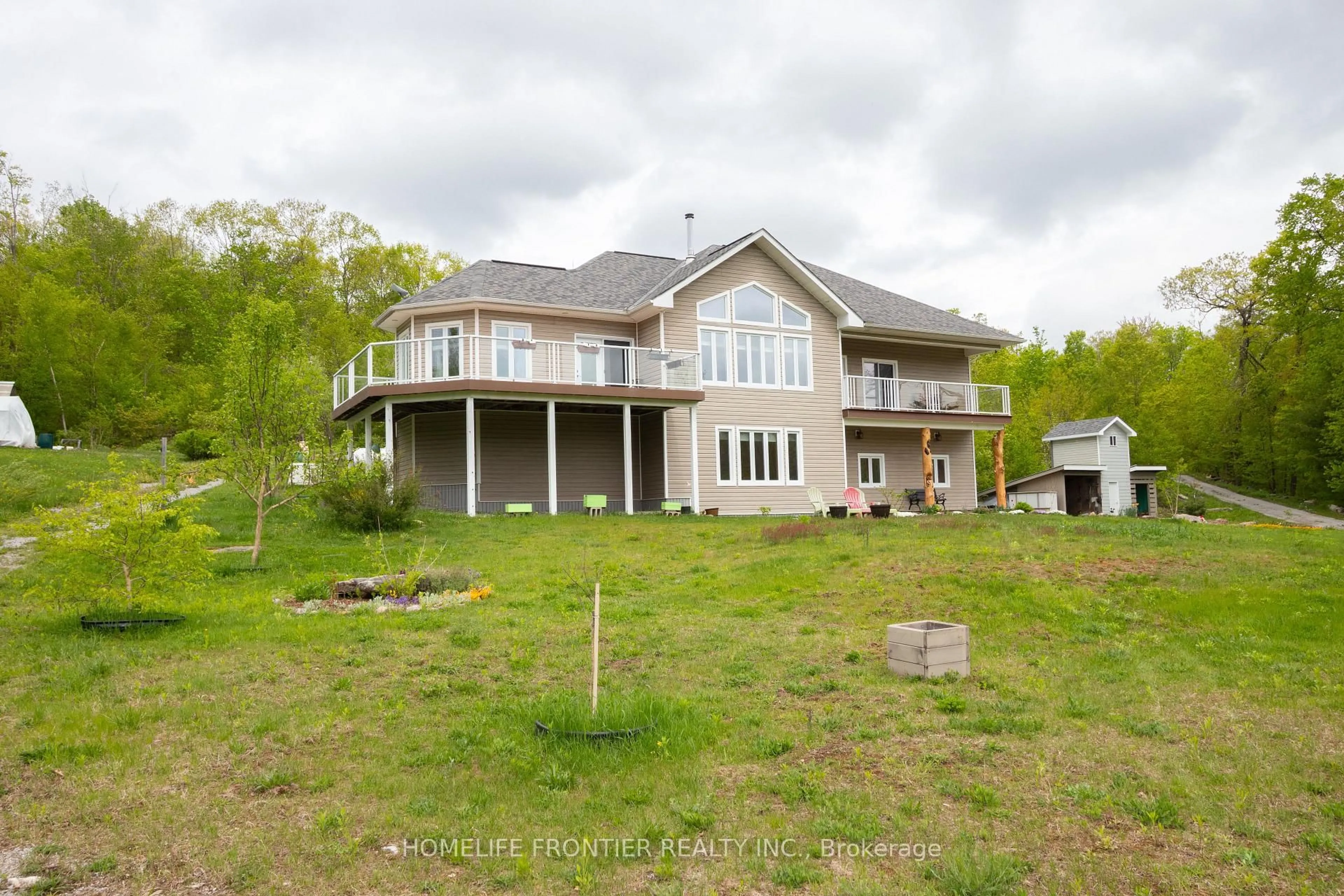 A pic from outside/outdoor area/front of a property/back of a property/a pic from drone, water/lake/river/ocean view for 1019 Silk Lane, Minden Hills Ontario K0M 2K0
