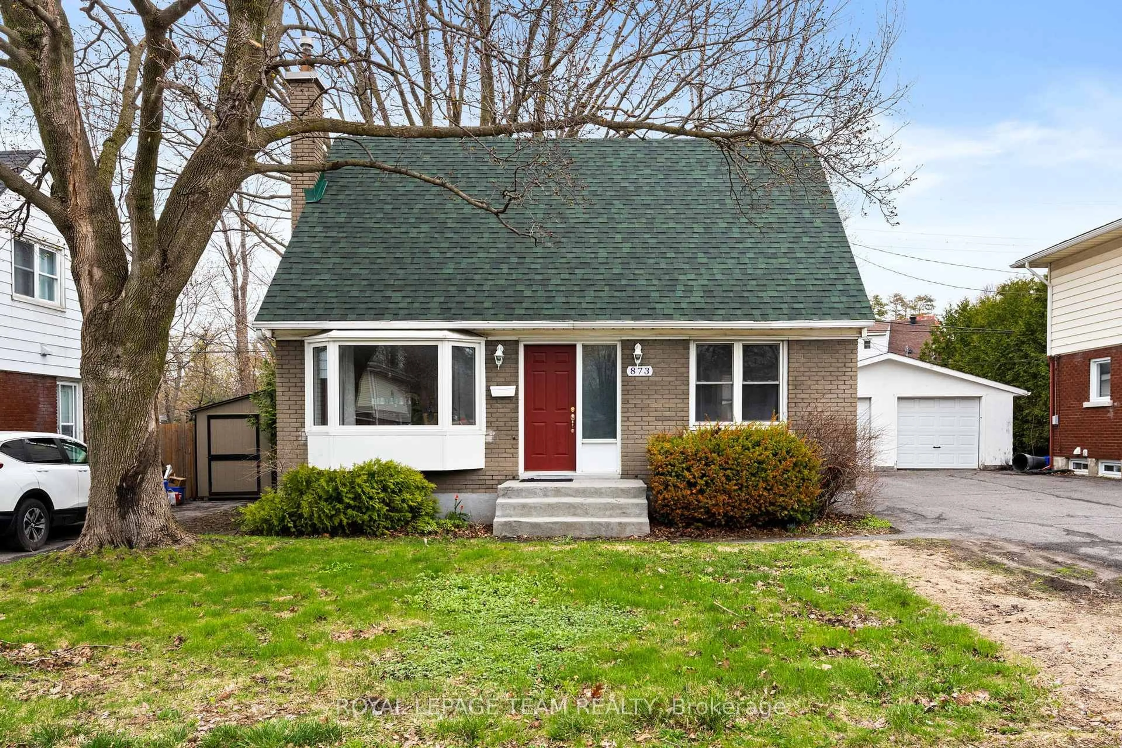 Home with vinyl exterior material, street for 873 Smyth Rd, Ottawa Ontario K1G 1P4