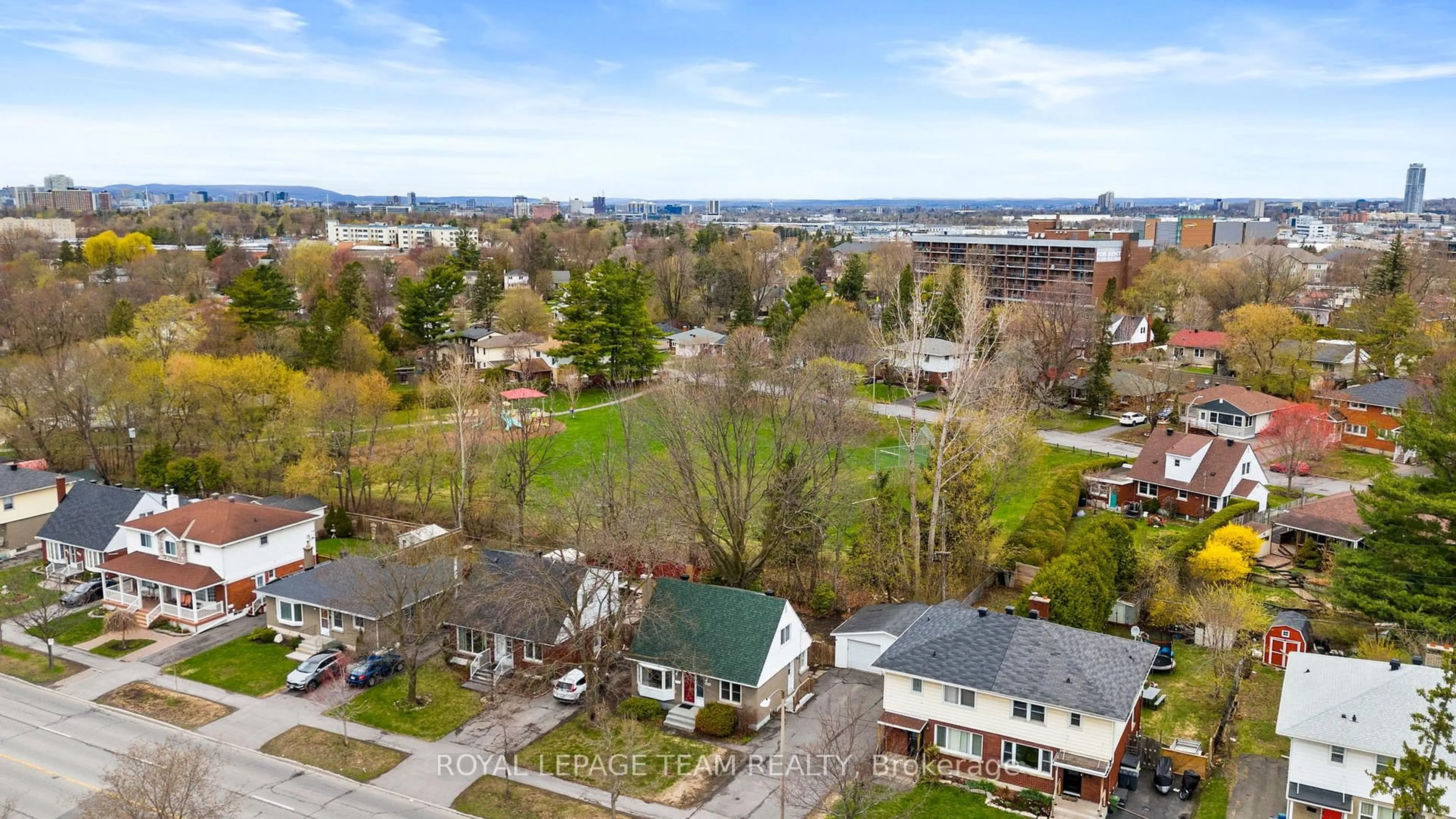 A pic from outside/outdoor area/front of a property/back of a property/a pic from drone, city buildings view from balcony for 873 Smyth Rd, Ottawa Ontario K1G 1P4
