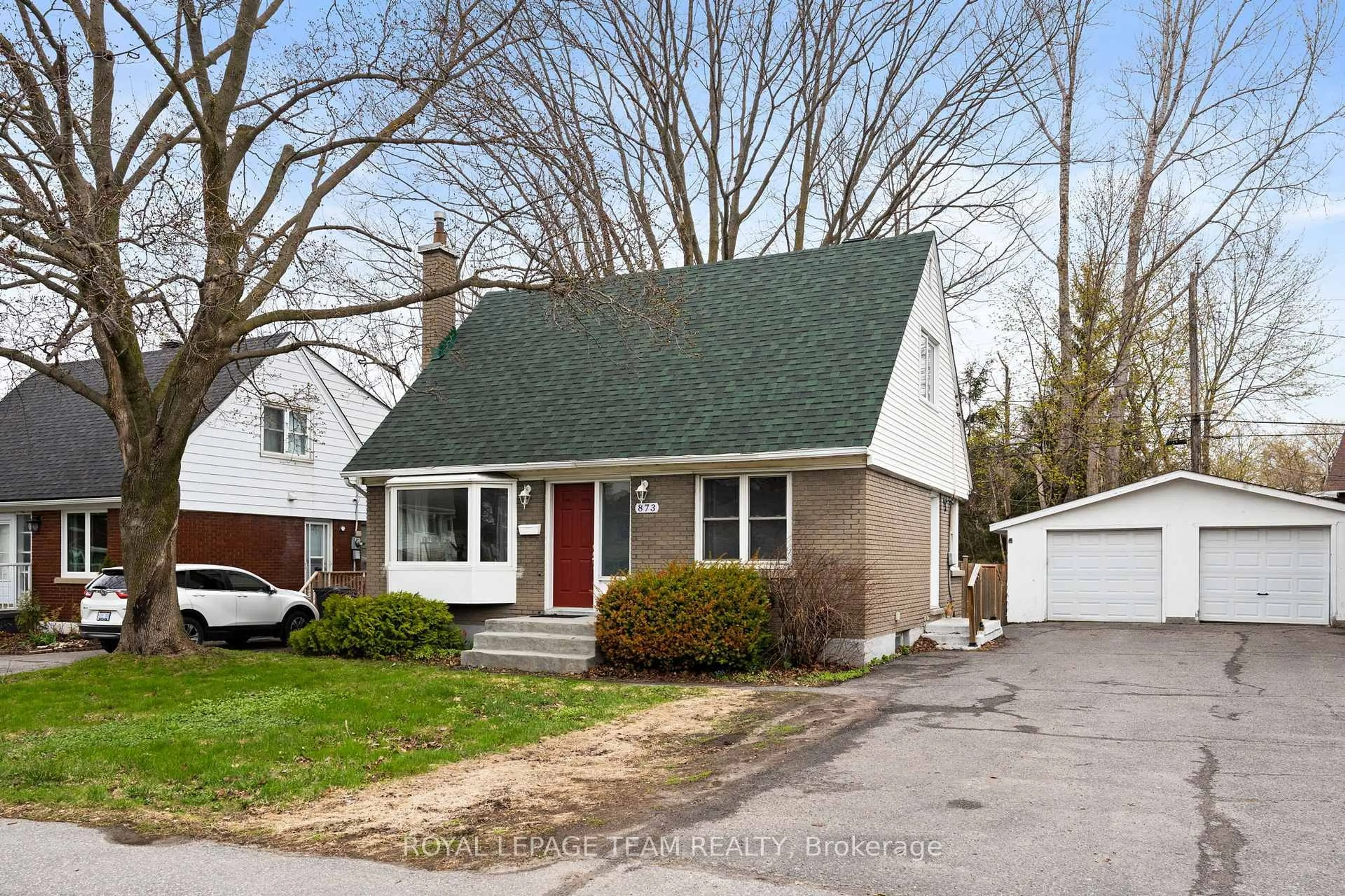 Home with vinyl exterior material, street for 873 Smyth Rd, Ottawa Ontario K1G 1P4