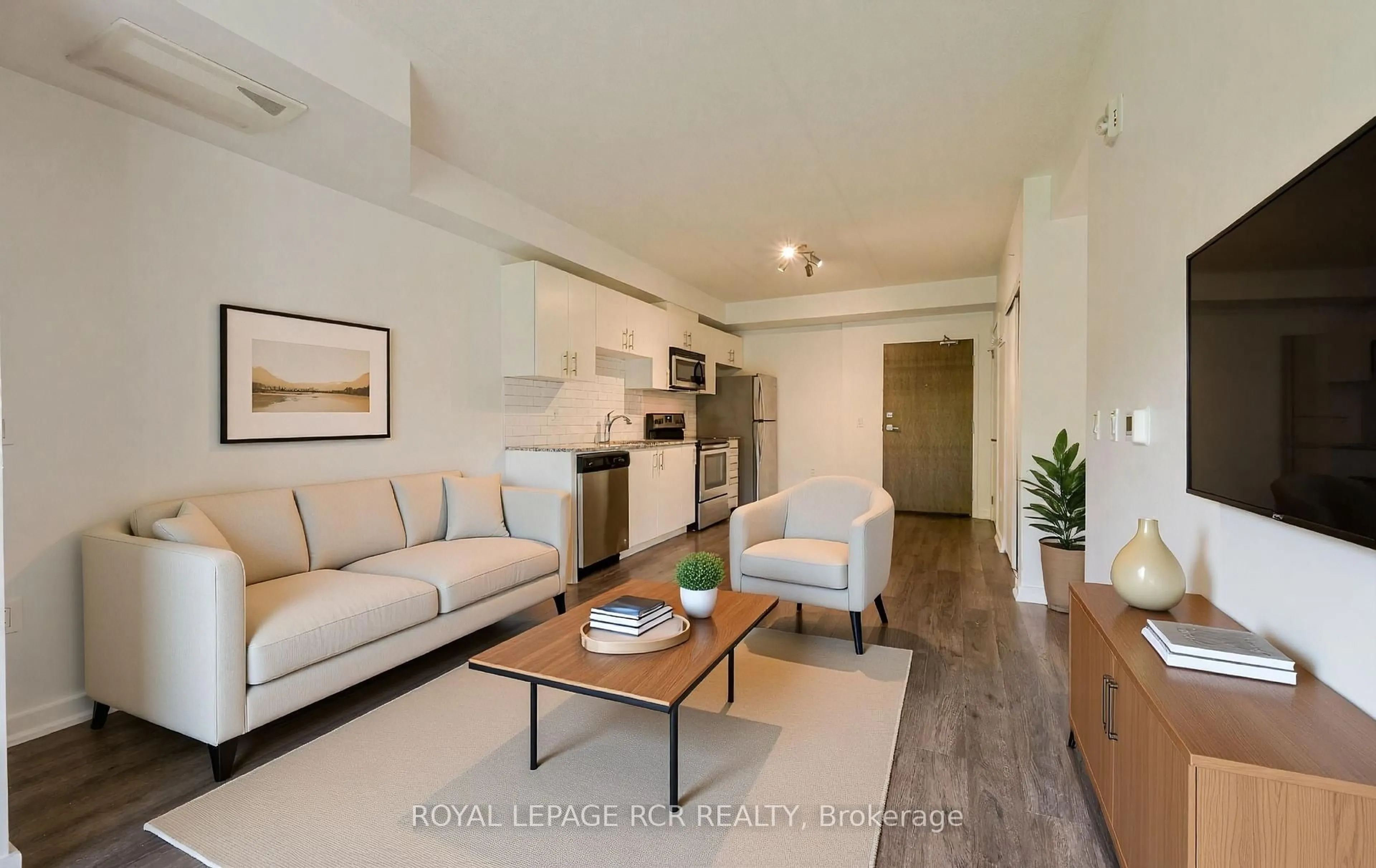 Living room with furniture, wood/laminate floor for 25 Kay Cres #LL02, Guelph Ontario N1L 0P2