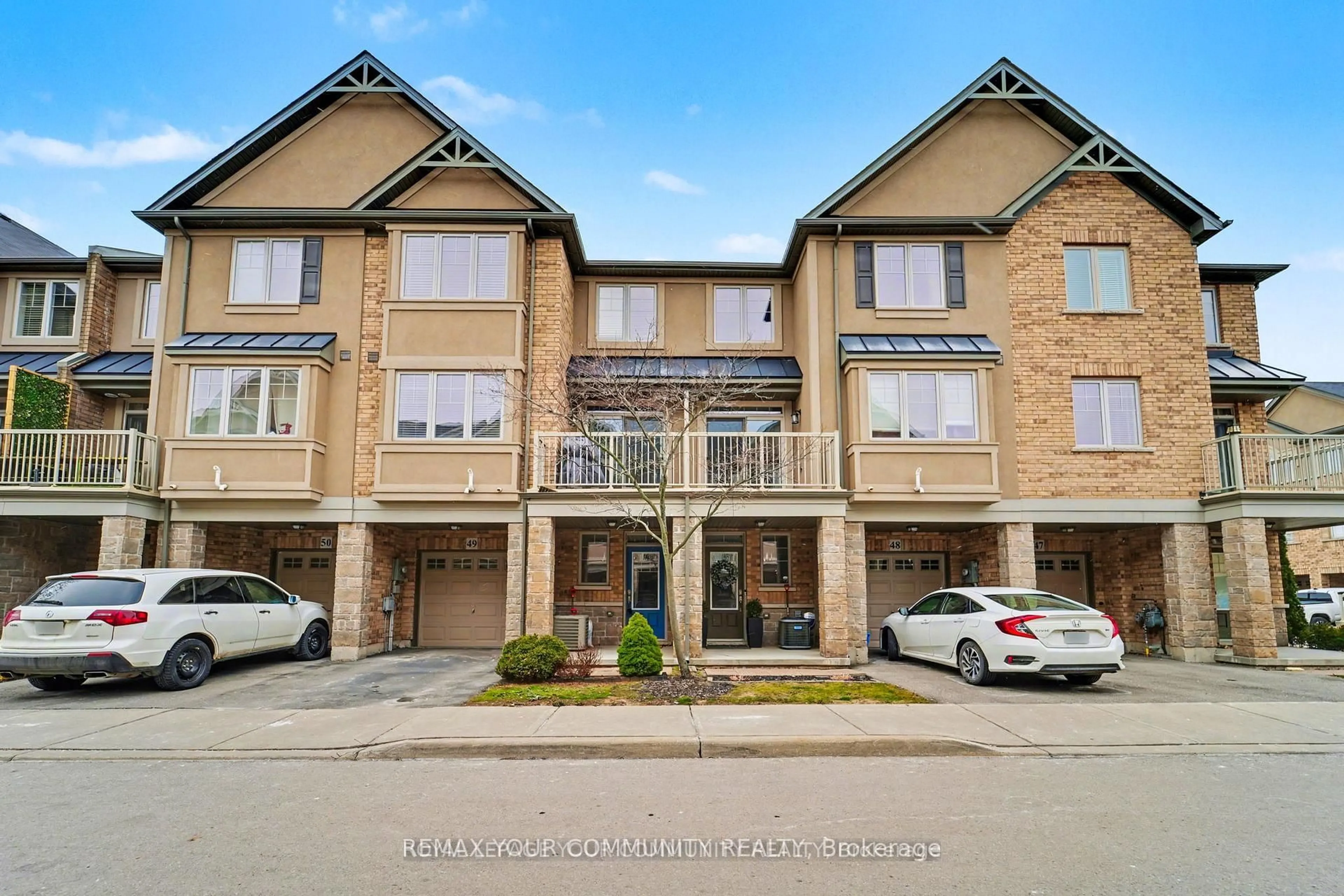A pic from outside/outdoor area/front of a property/back of a property/a pic from drone, street for 201 Westbank Tr #49, Hamilton Ontario L8J 0H4