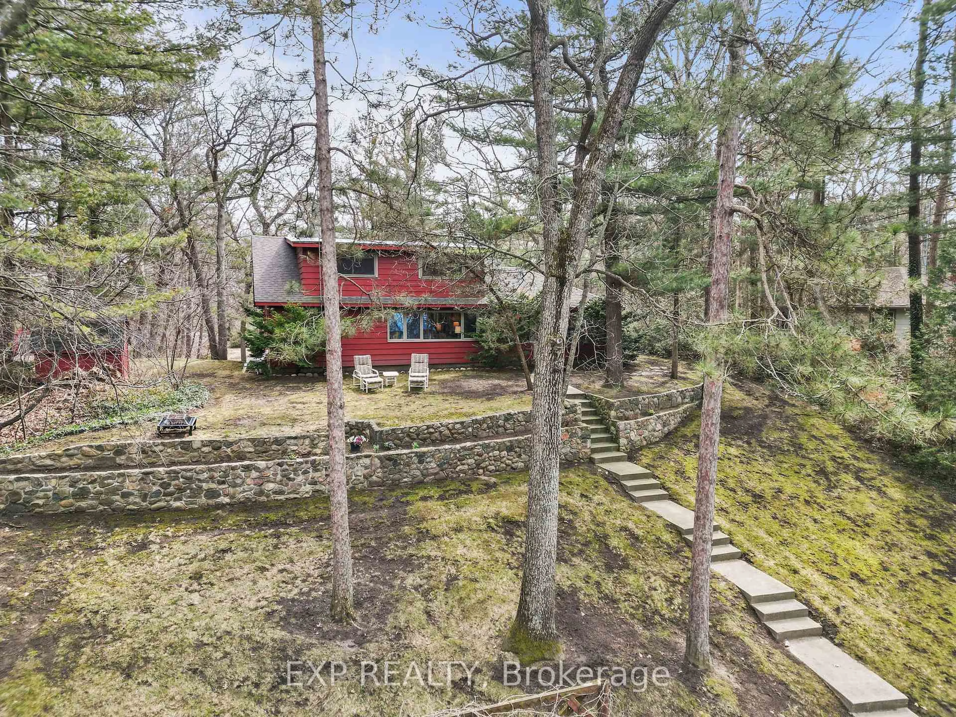 A pic from outside/outdoor area/front of a property/back of a property/a pic from drone, forest/trees view for 9 Summit Ave, South Huron Ontario N0M 1T0
